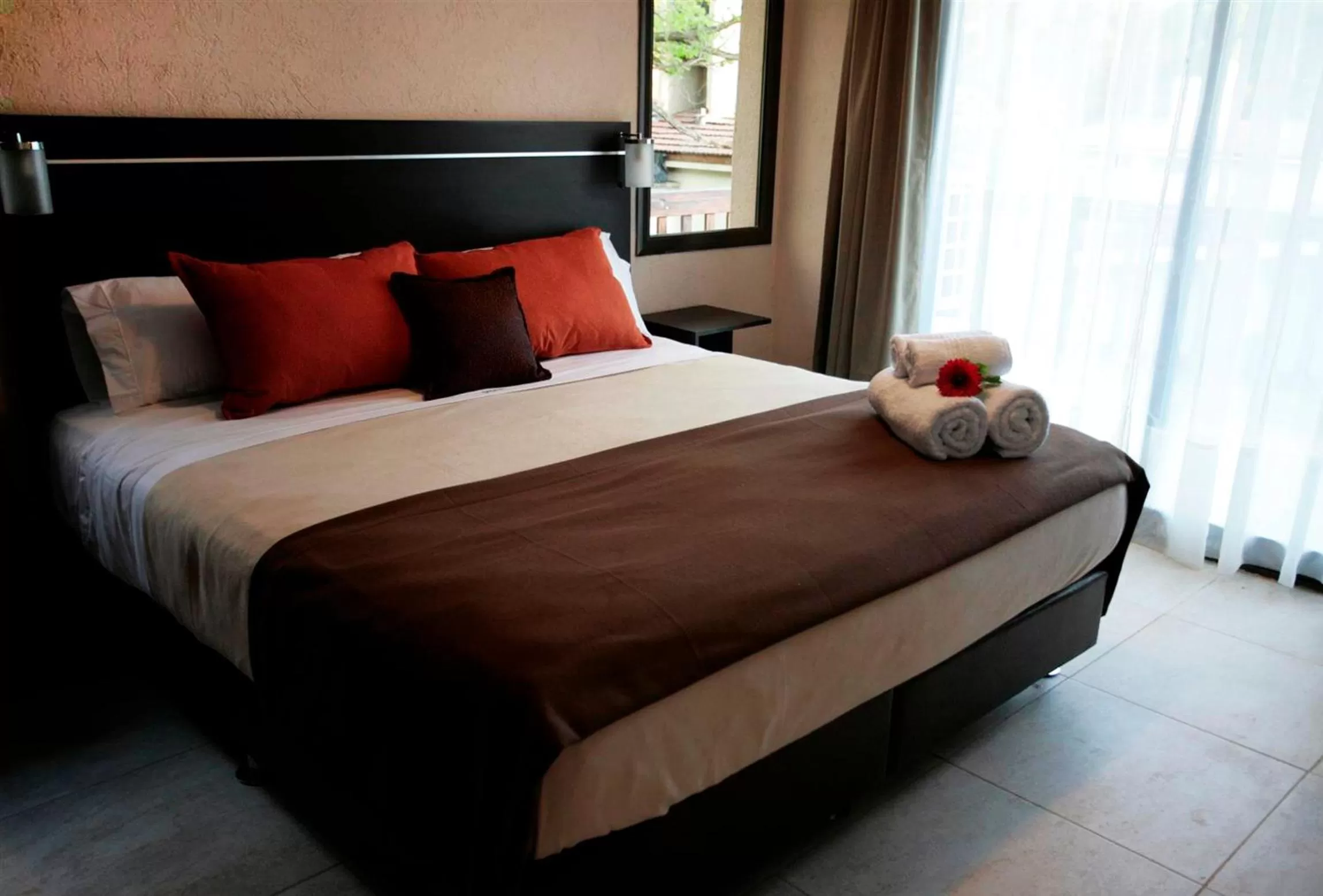 Bed in BlackStone Apart Boutique Hotel