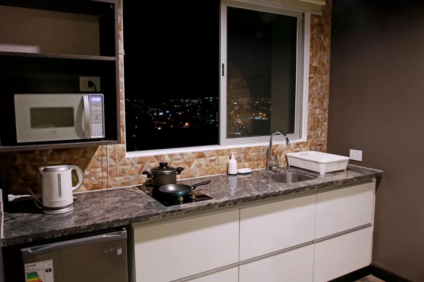 Kitchen or kitchenette in Urban Suites Apart Hotel