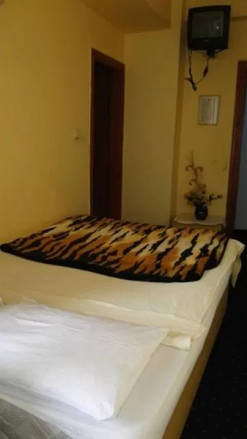 Bed in Sunrise Hotel