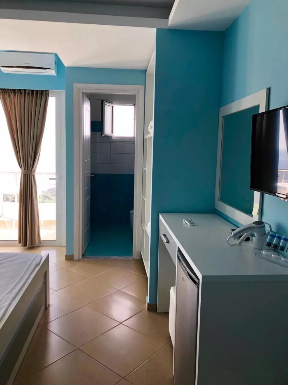 TV and multimedia, TV/Entertainment Center in Aphrodite Garden Rooms & Apartment