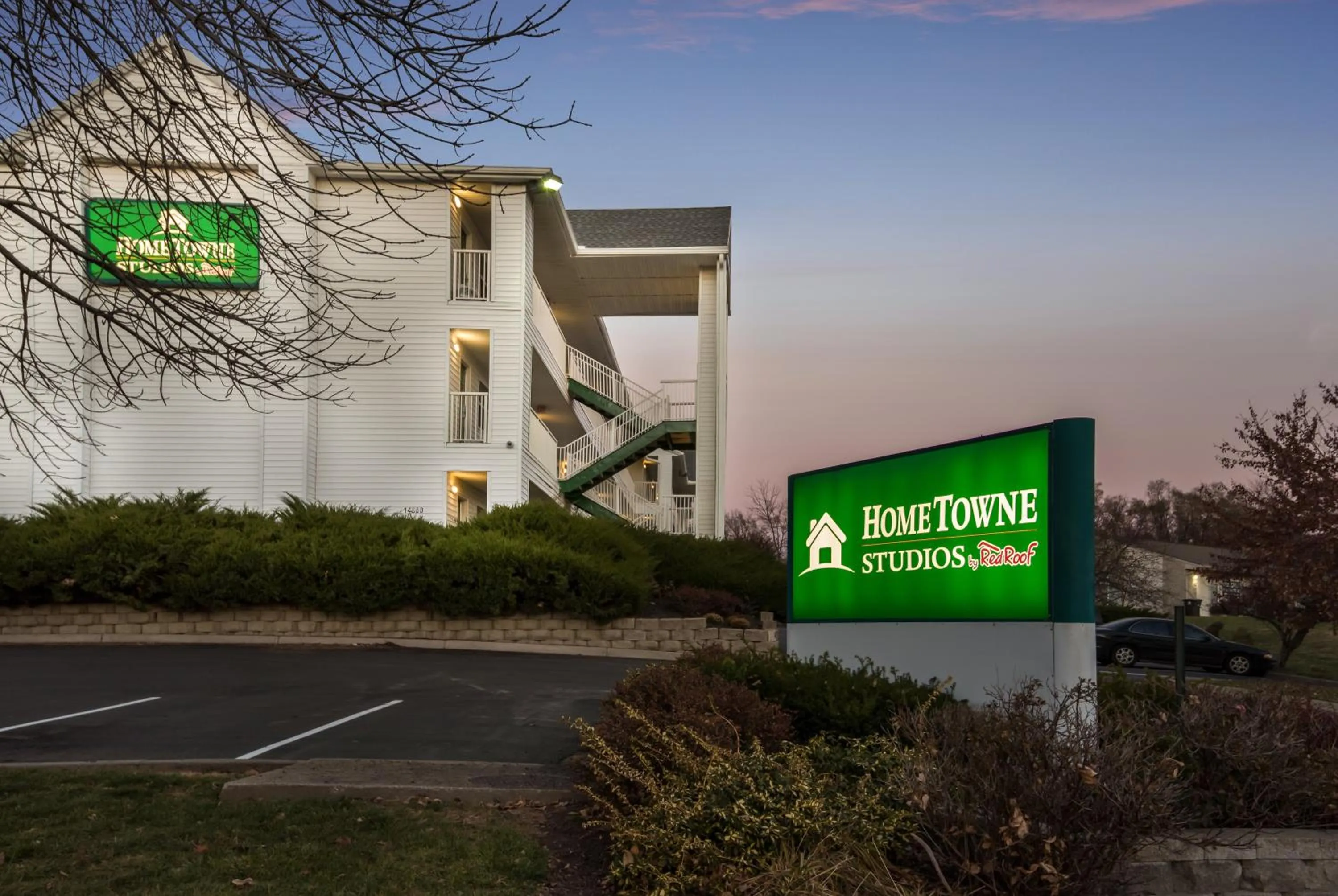 Property building, Property Logo/Sign in HomeTowne Studios by Red Roof Kansas City - Independence