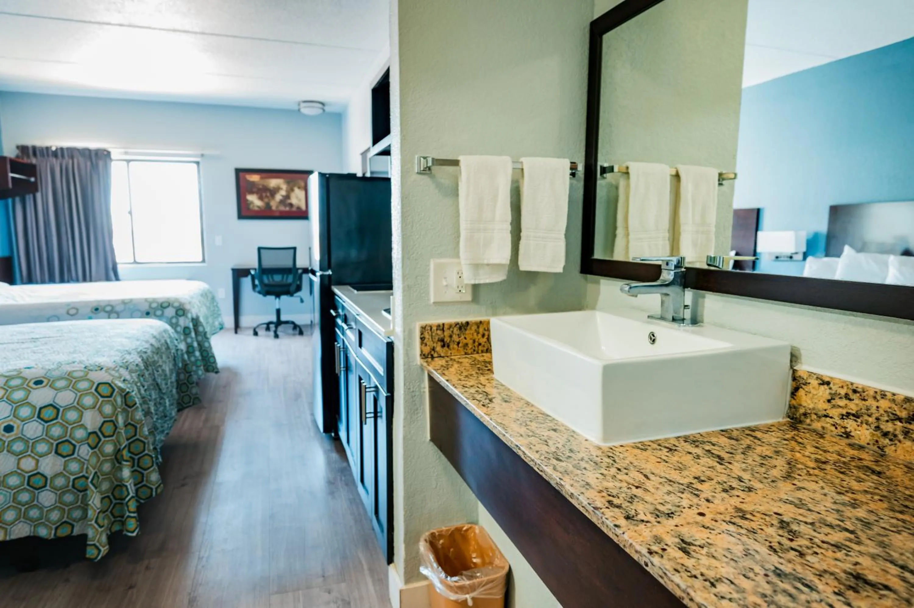 Bed in HomeTowne Studios by Red Roof San Antonio - SeaWorld Northwest