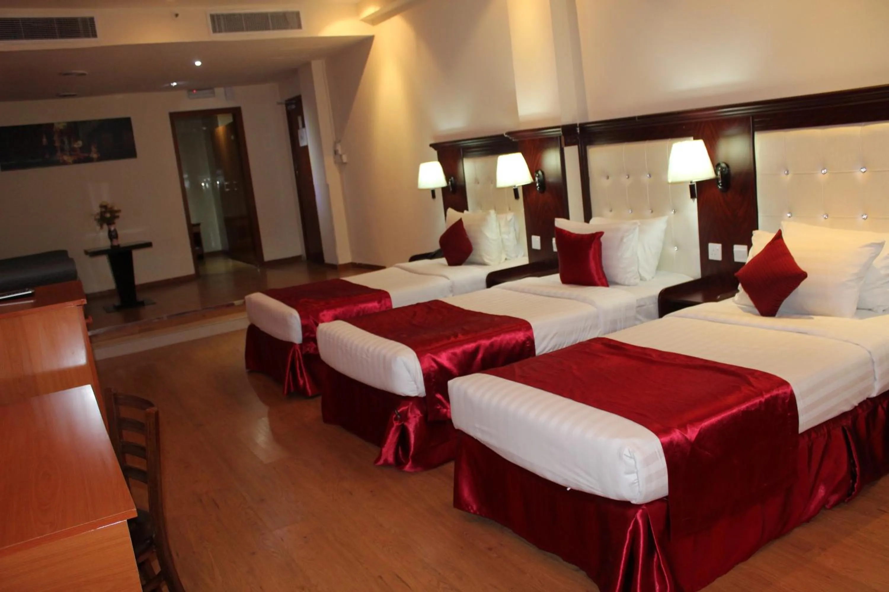 Bed in Grand Nova Hotel