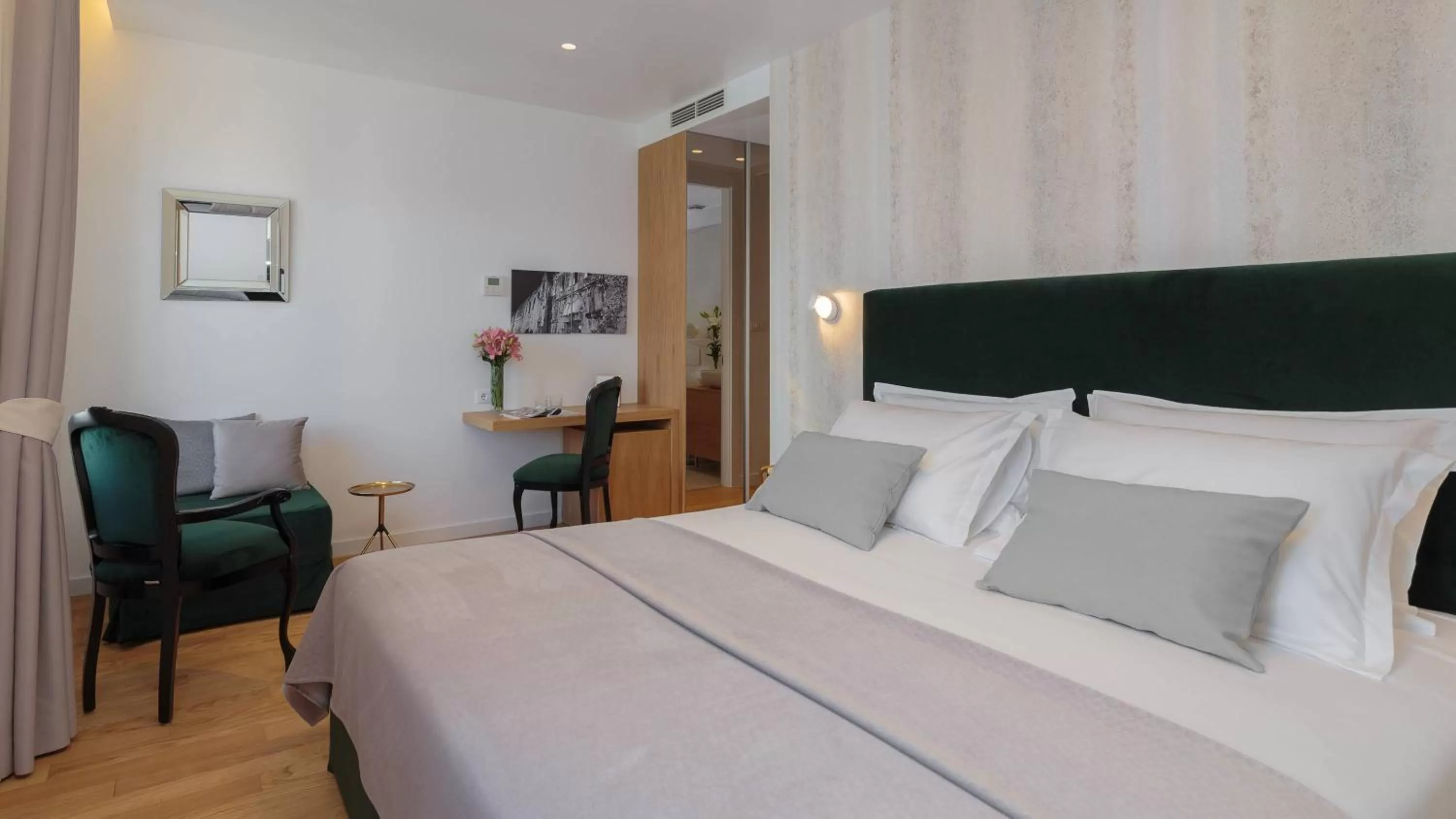 Bed in Belvedere Luxury Rooms - Breathtaking View