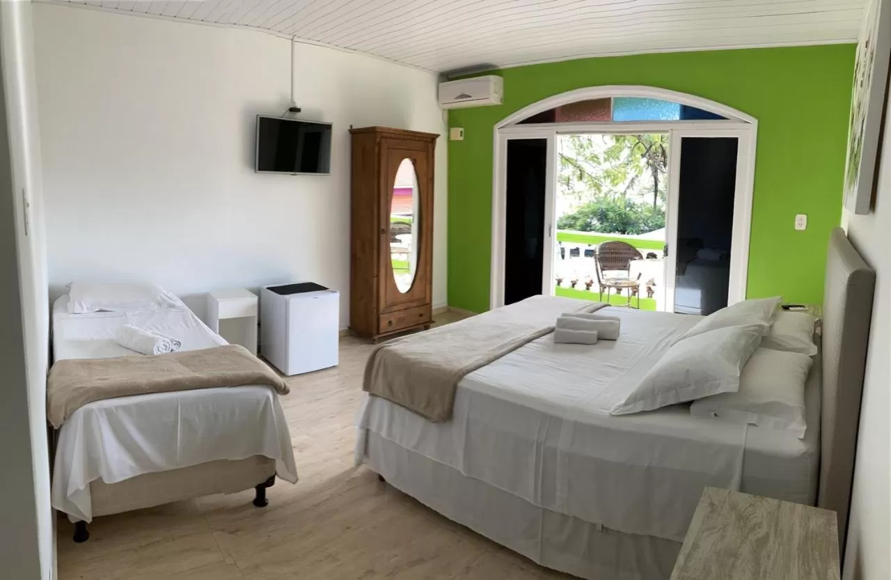 Bed in Pousada Marinamarela