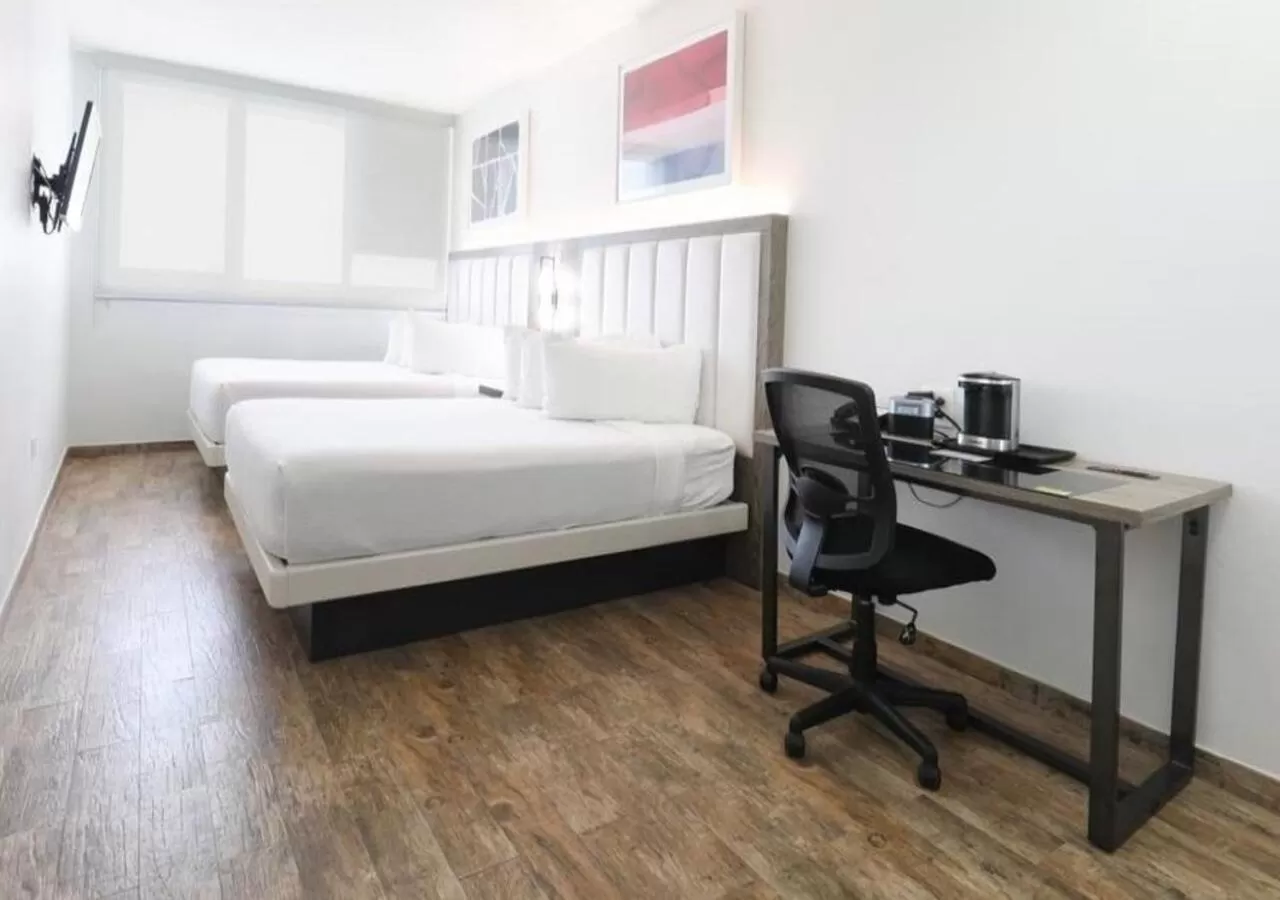 Bed in San Juan Airport Hotel