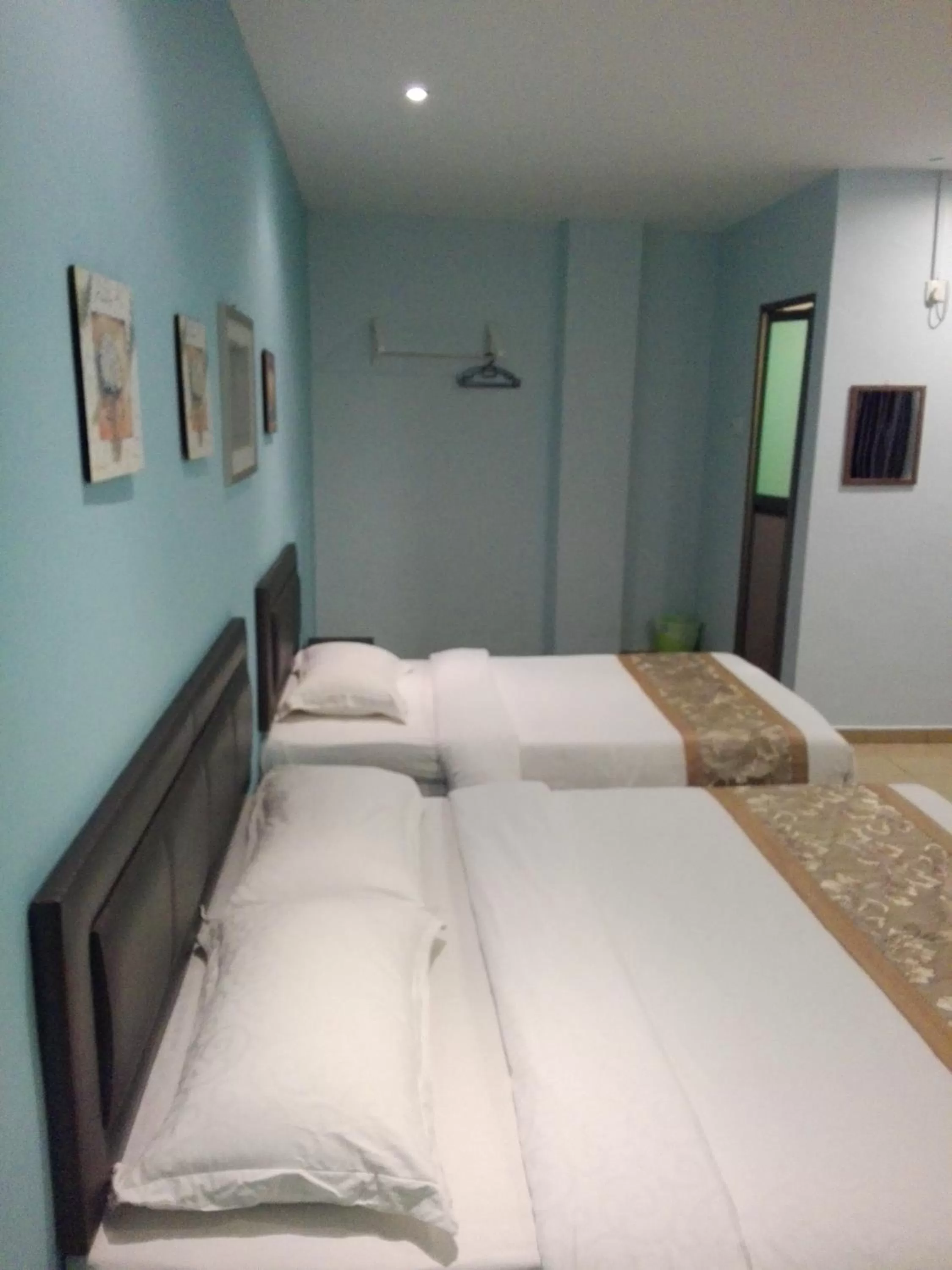 Photo of the whole room, Bed in TIONG HUA HOTEL