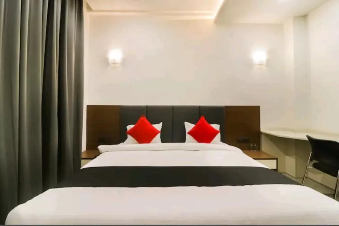 Bed in Hotel Nikhil Regency