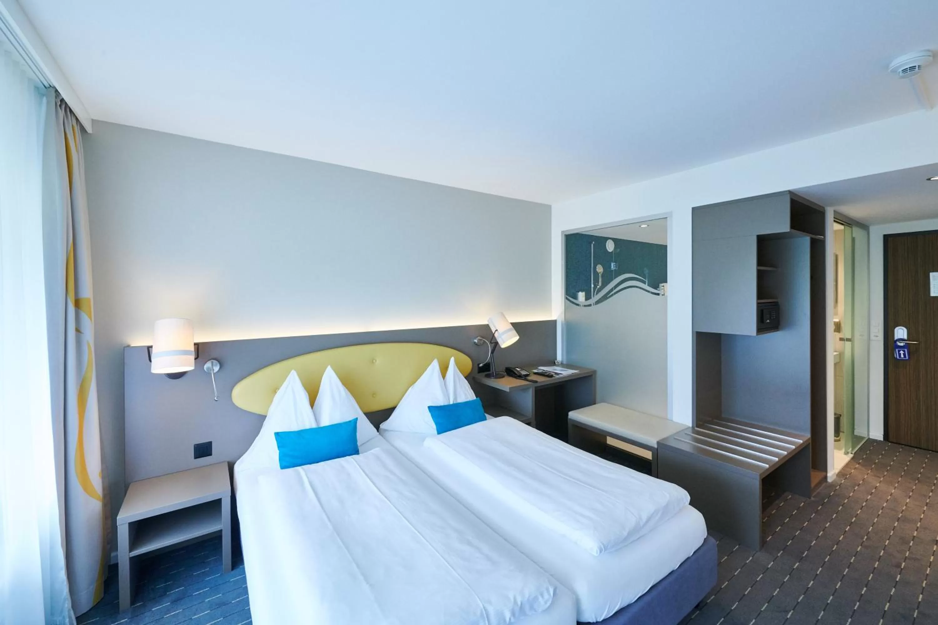 Bed in Hotel Holiday Thun