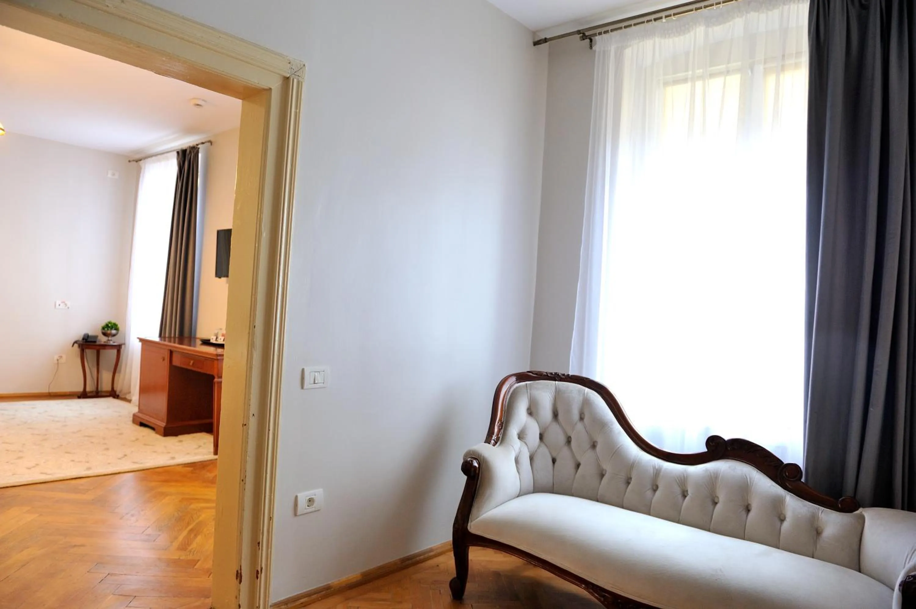 Seating area, Bed in Safrano Palace