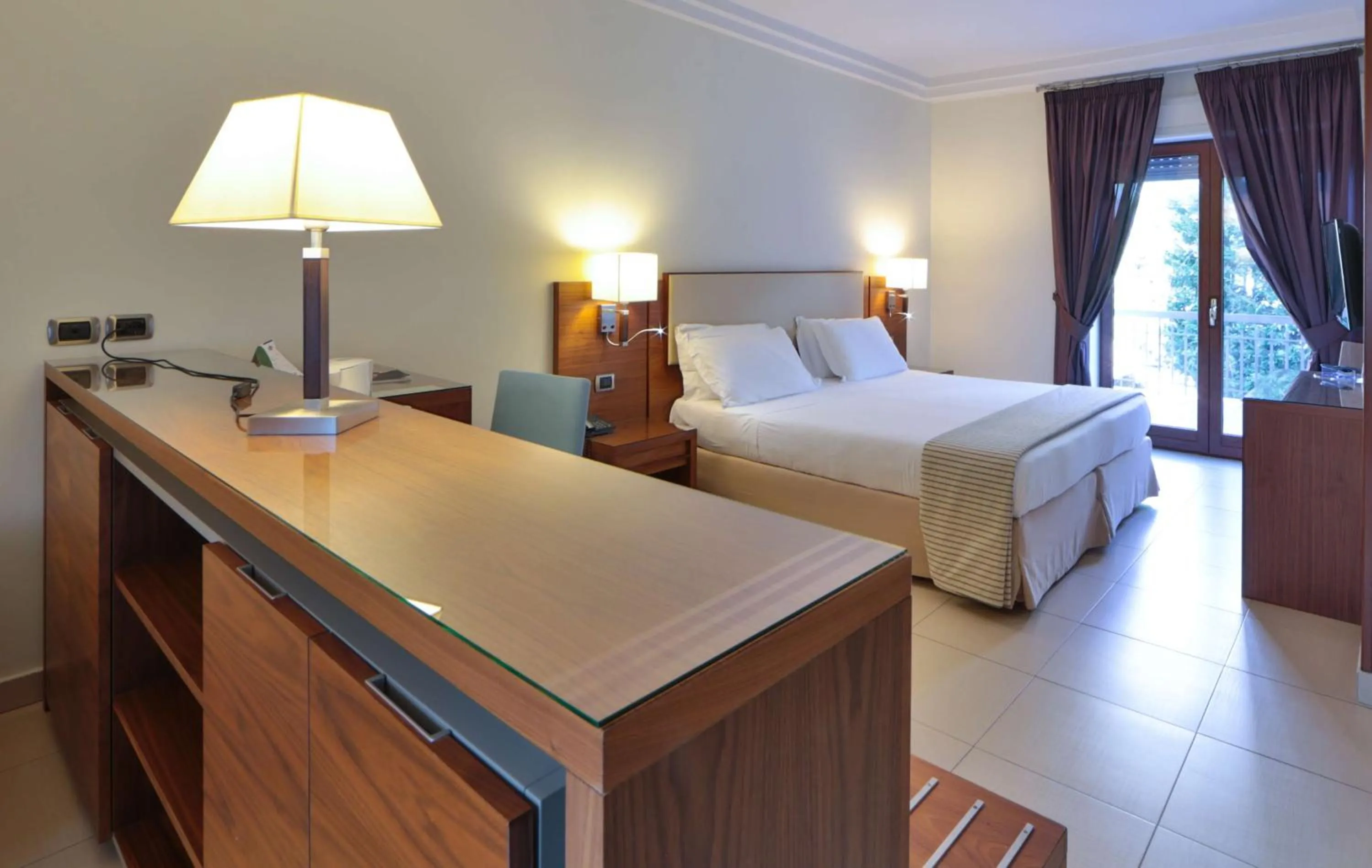 Bed in Suites & Residence Hotel