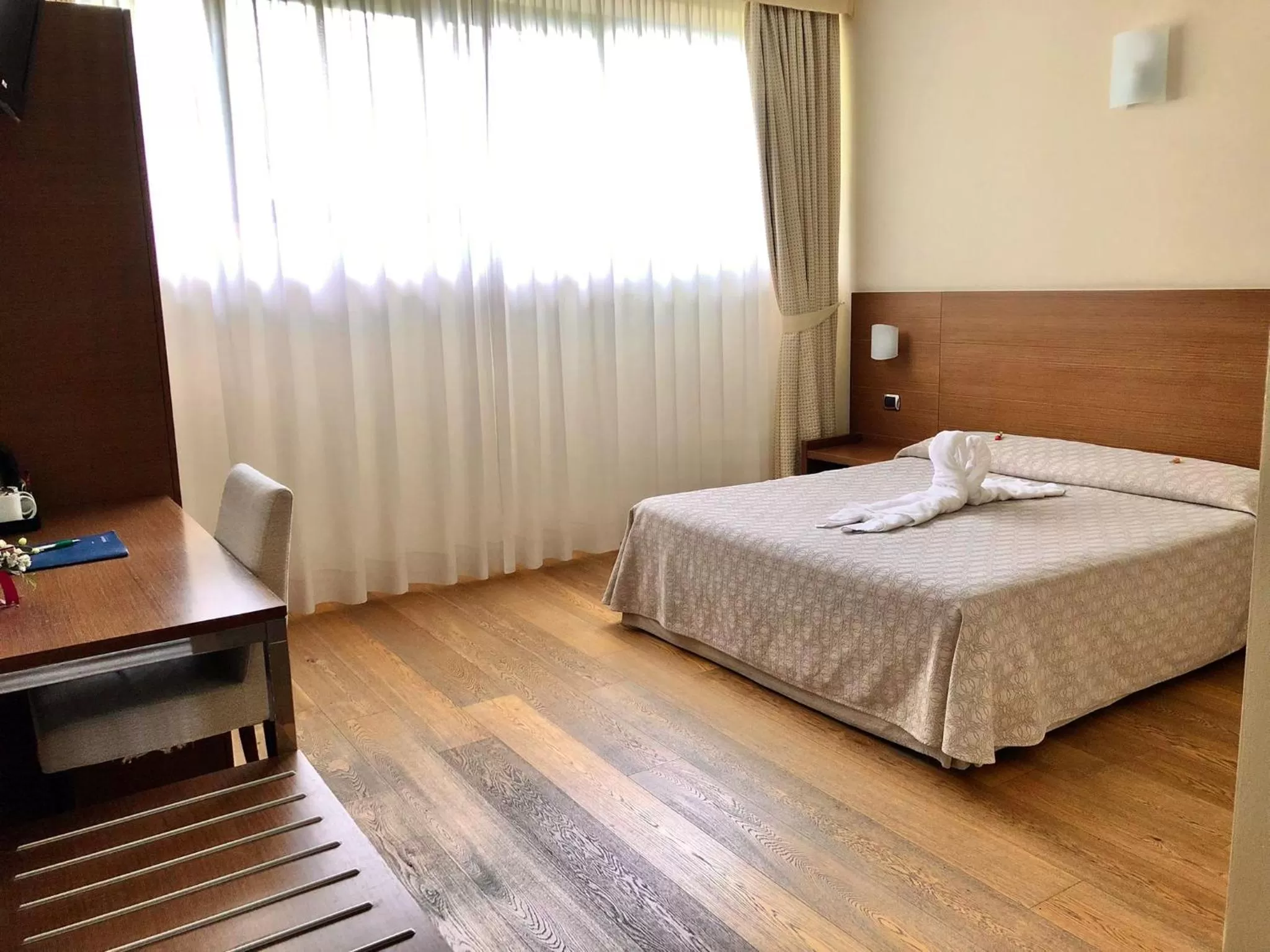 Bed in Hotel Lovere Resort & Spa