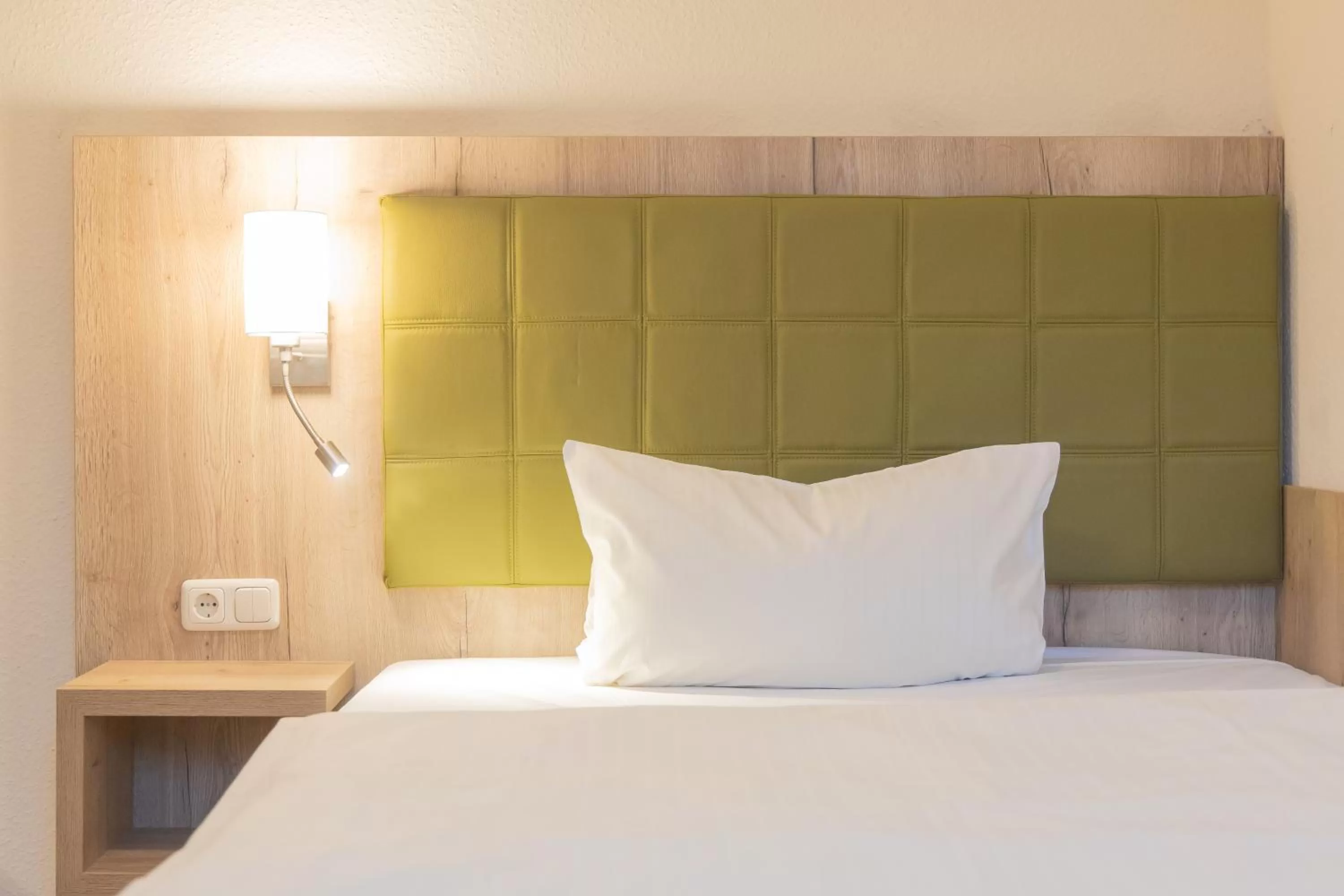 Bed in Hermes Hotel Oldenburg