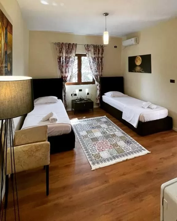 Bed in Hotel Ambasador Garden