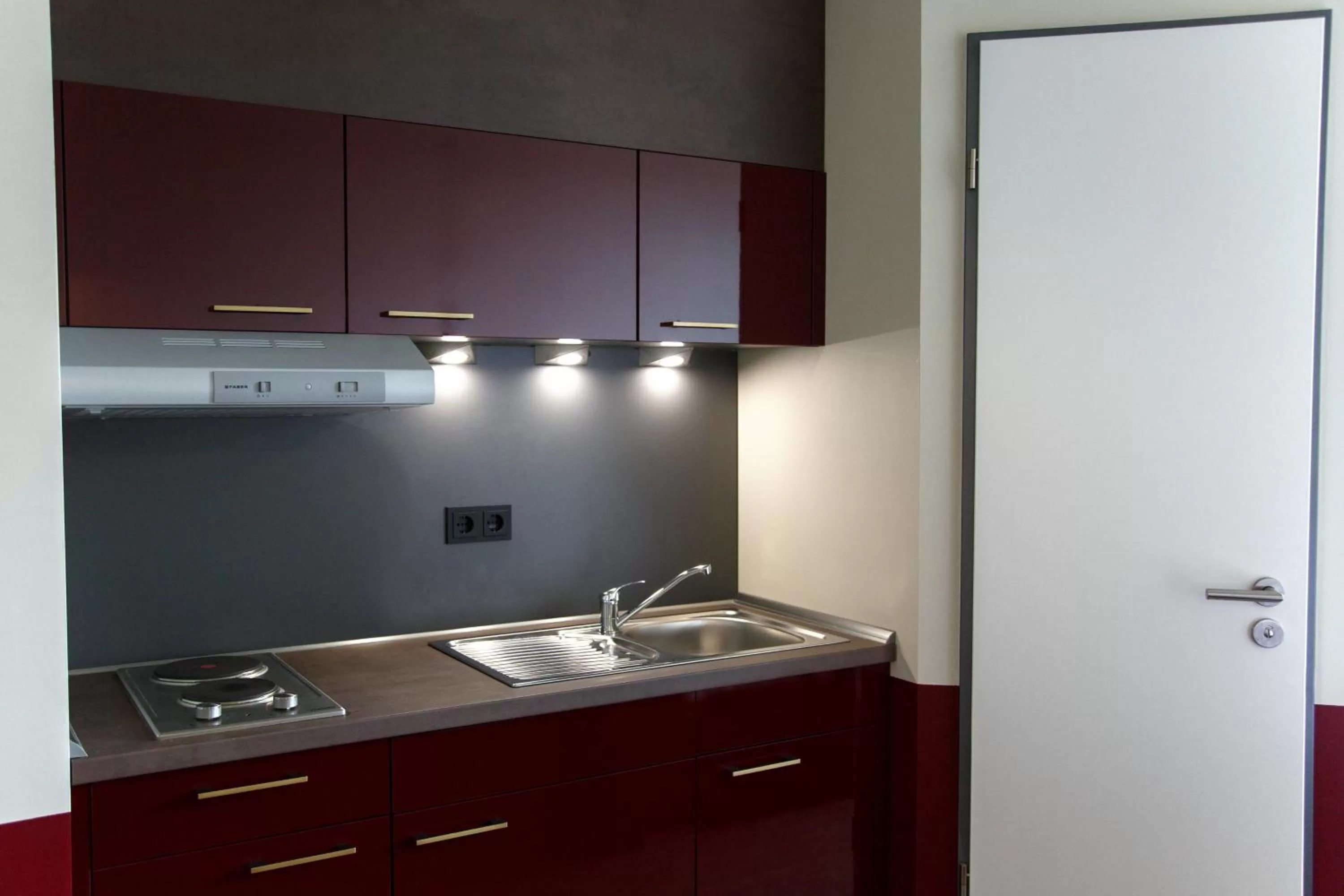 Kitchen or kitchenette in Base Apartments