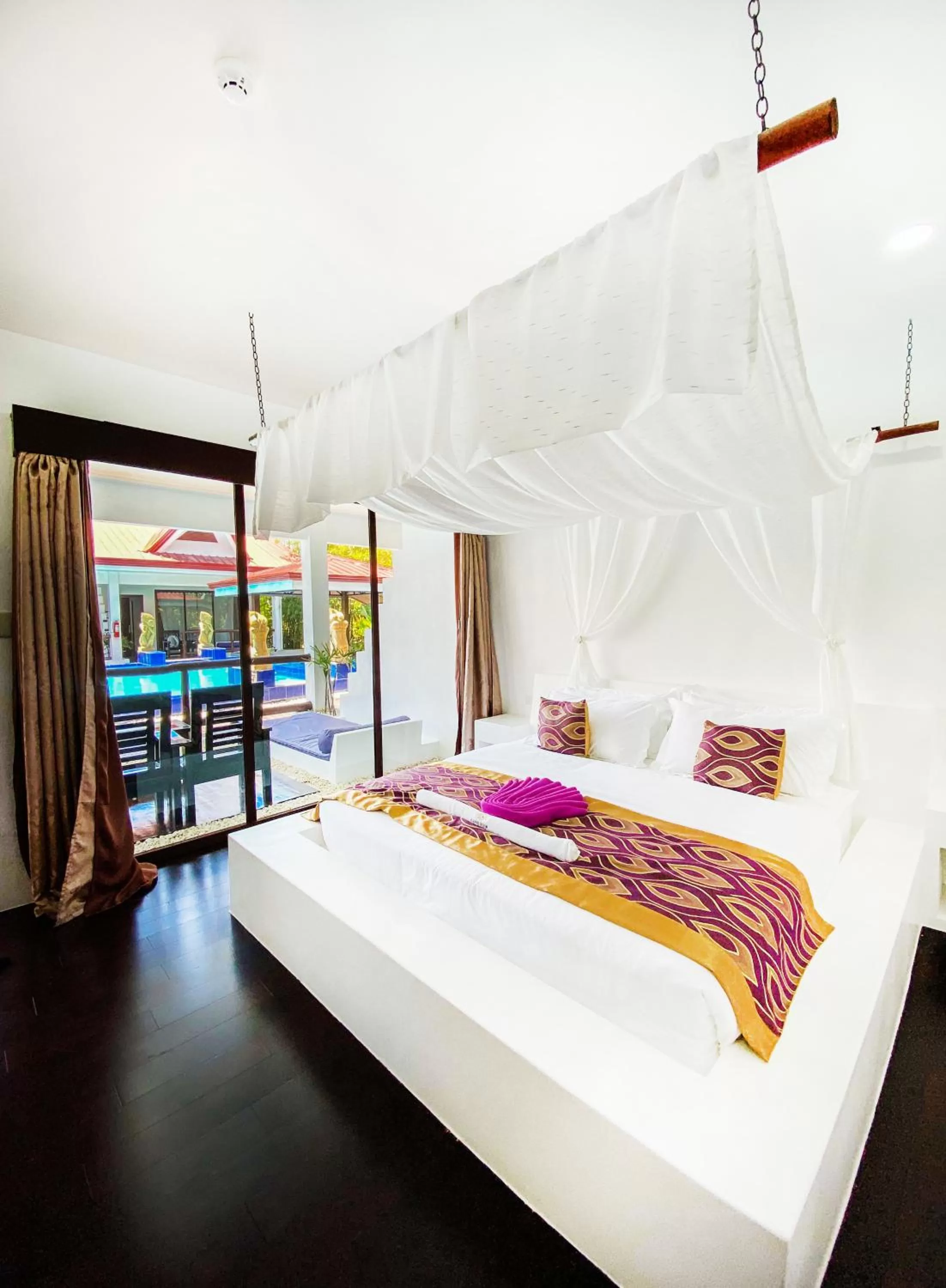 Bed in Carpe Diem Villas & Resort Dive & Stay resort