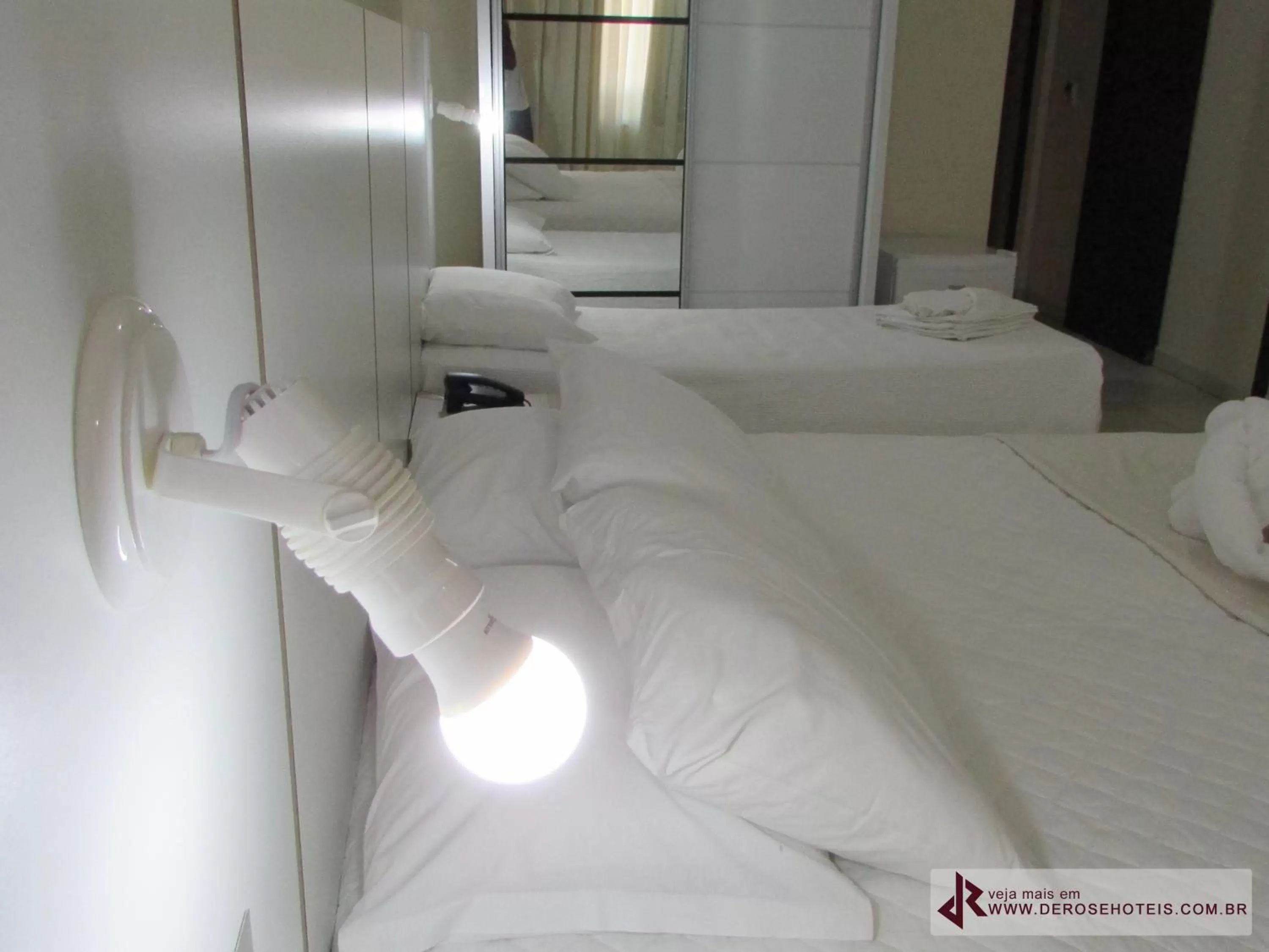 Bed in De Rose Palace Hotel