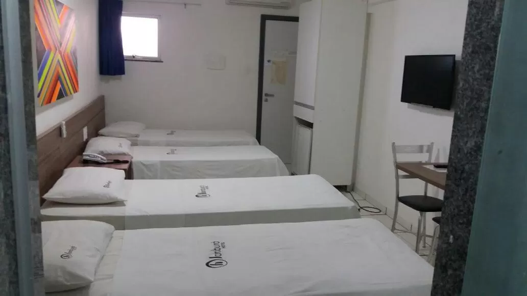 Bed in Sambura Hotel