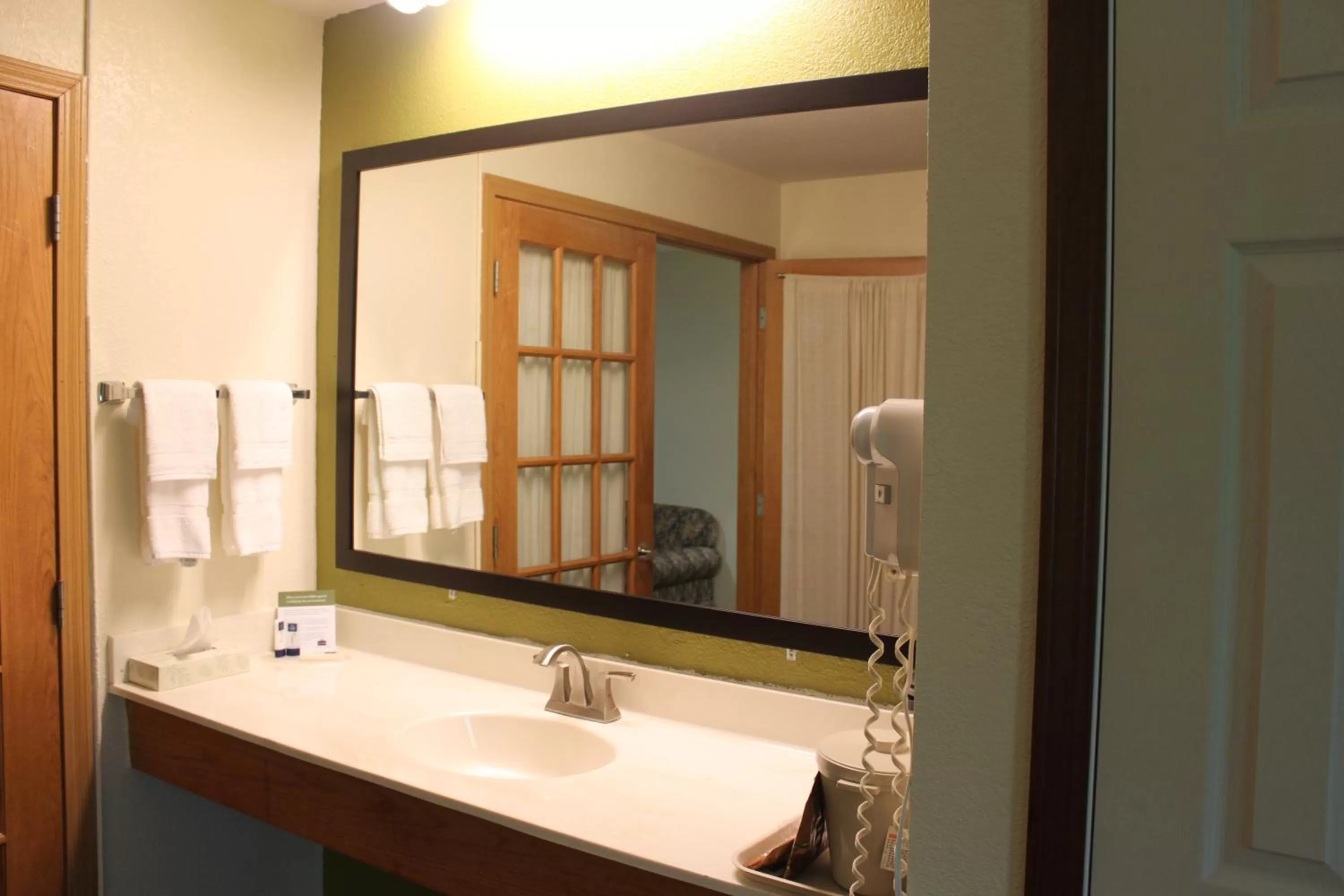 Bathroom in AmericInn by Wyndham West Burlington