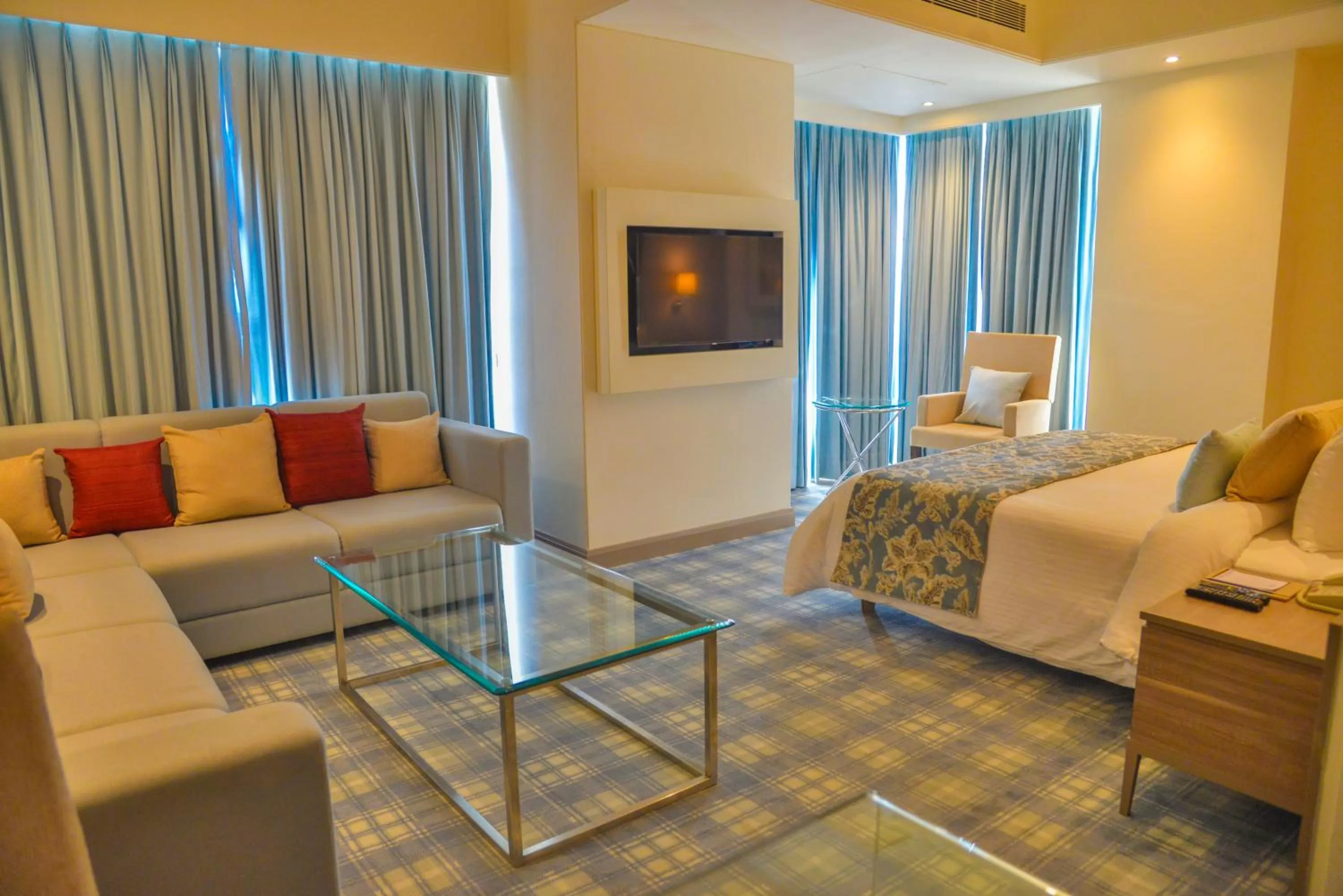 Living room, Bed in Efcee Sarovar Premiere Bhavnagar