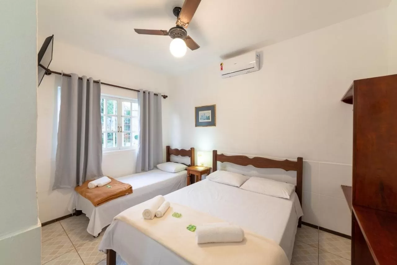 Bed in Pousada Portal de Paraty