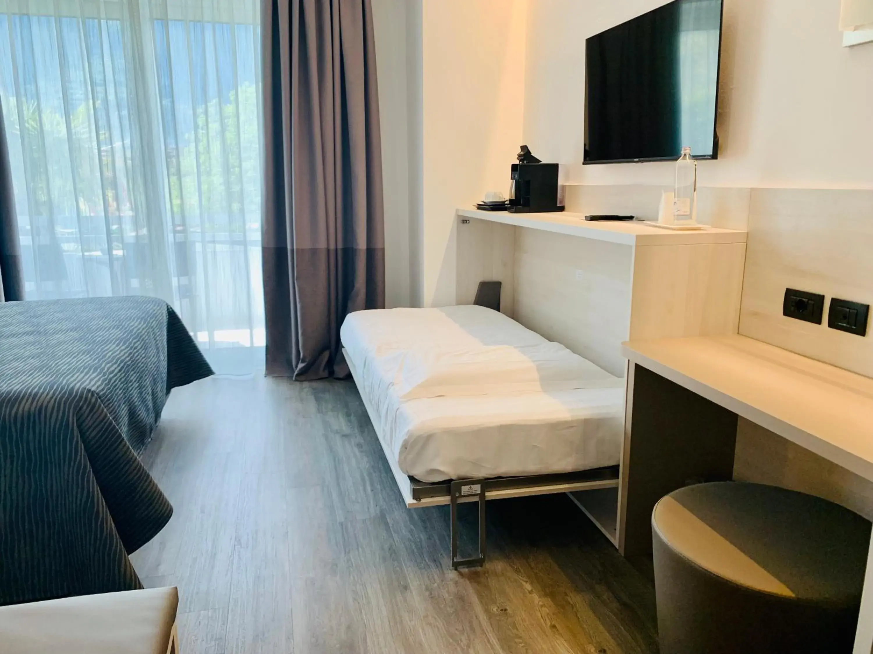 Comfort Triple Room with Garden View in Hotel Campagnola Comfort Triple Room with Garden View in Hotel Campagnola