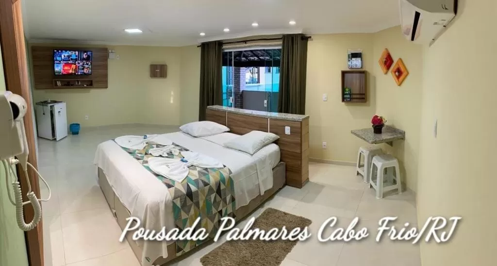 Bed in Pousada Palmares