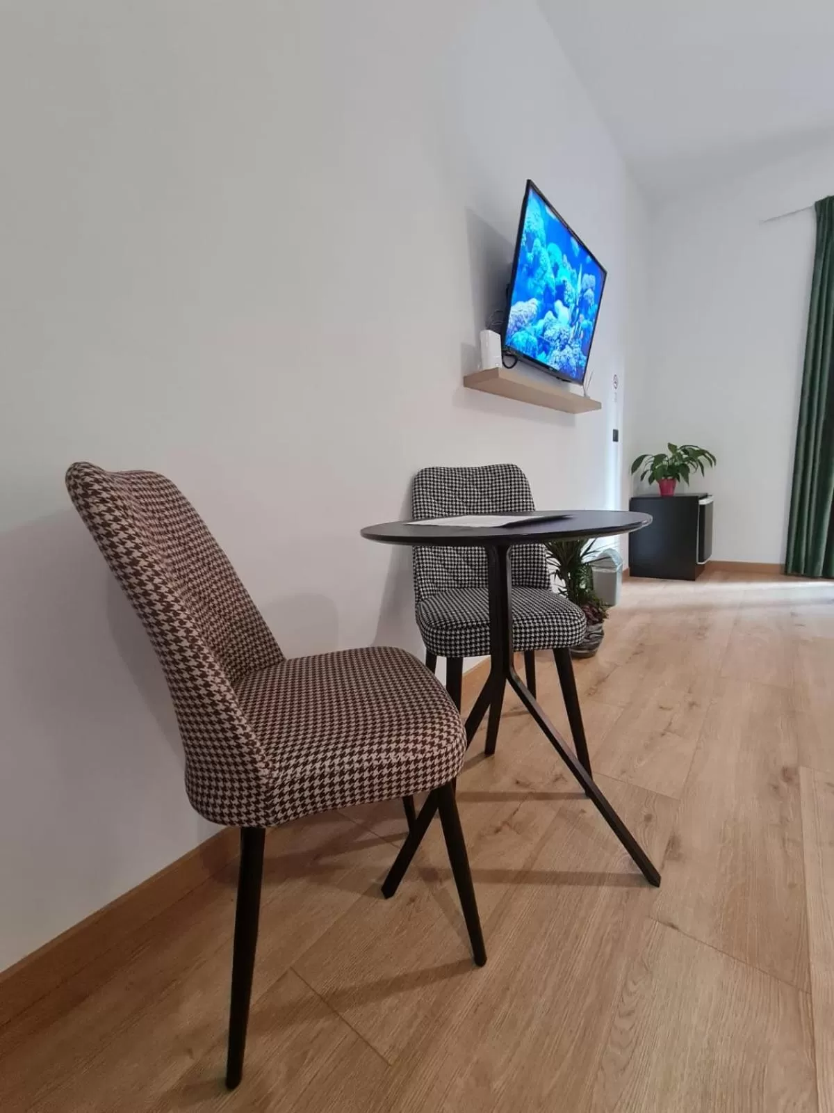 Communal lounge/ TV room in Vila Jasmine