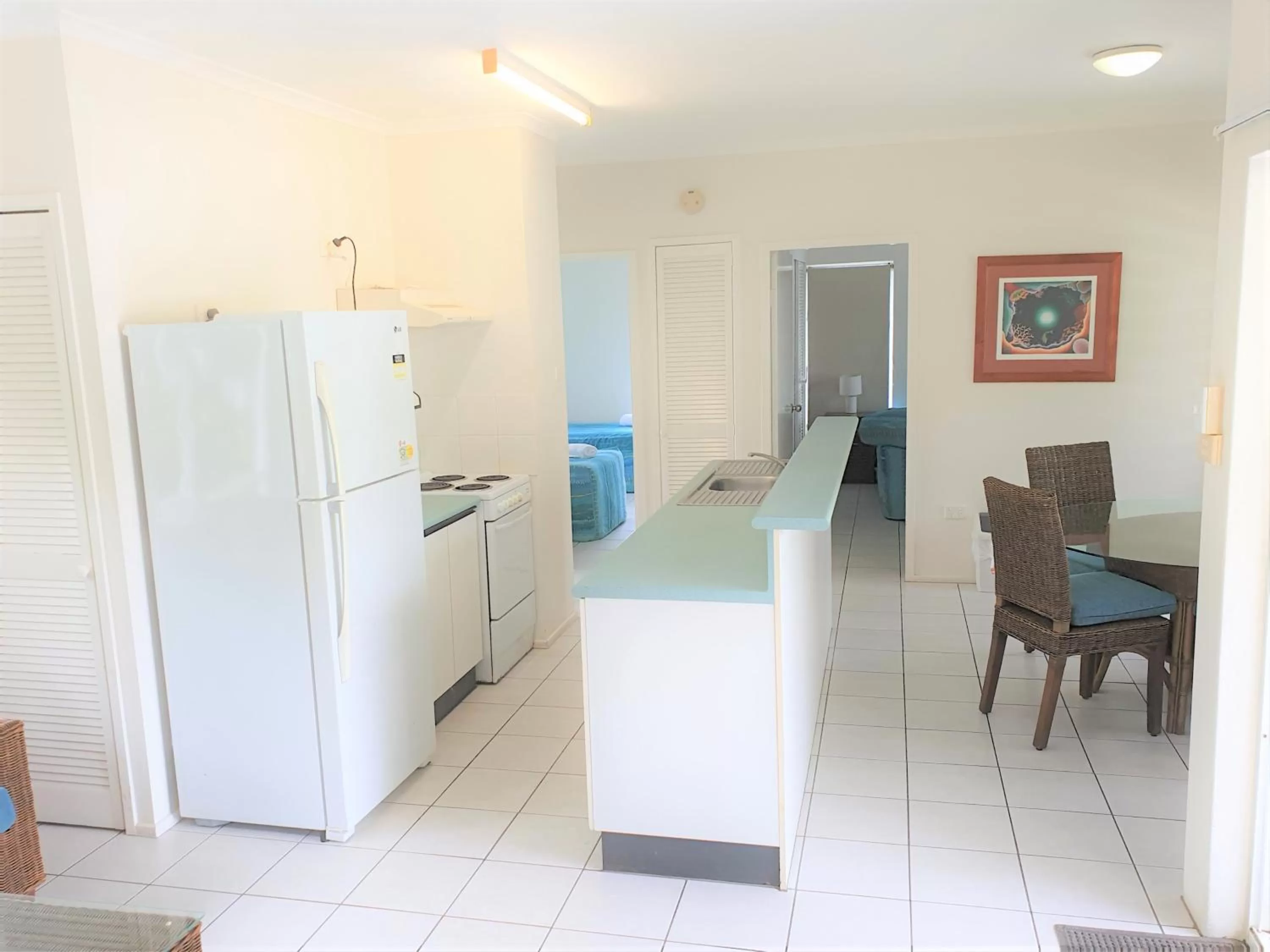 Kitchen or kitchenette in Mango Tree Holiday Apartments