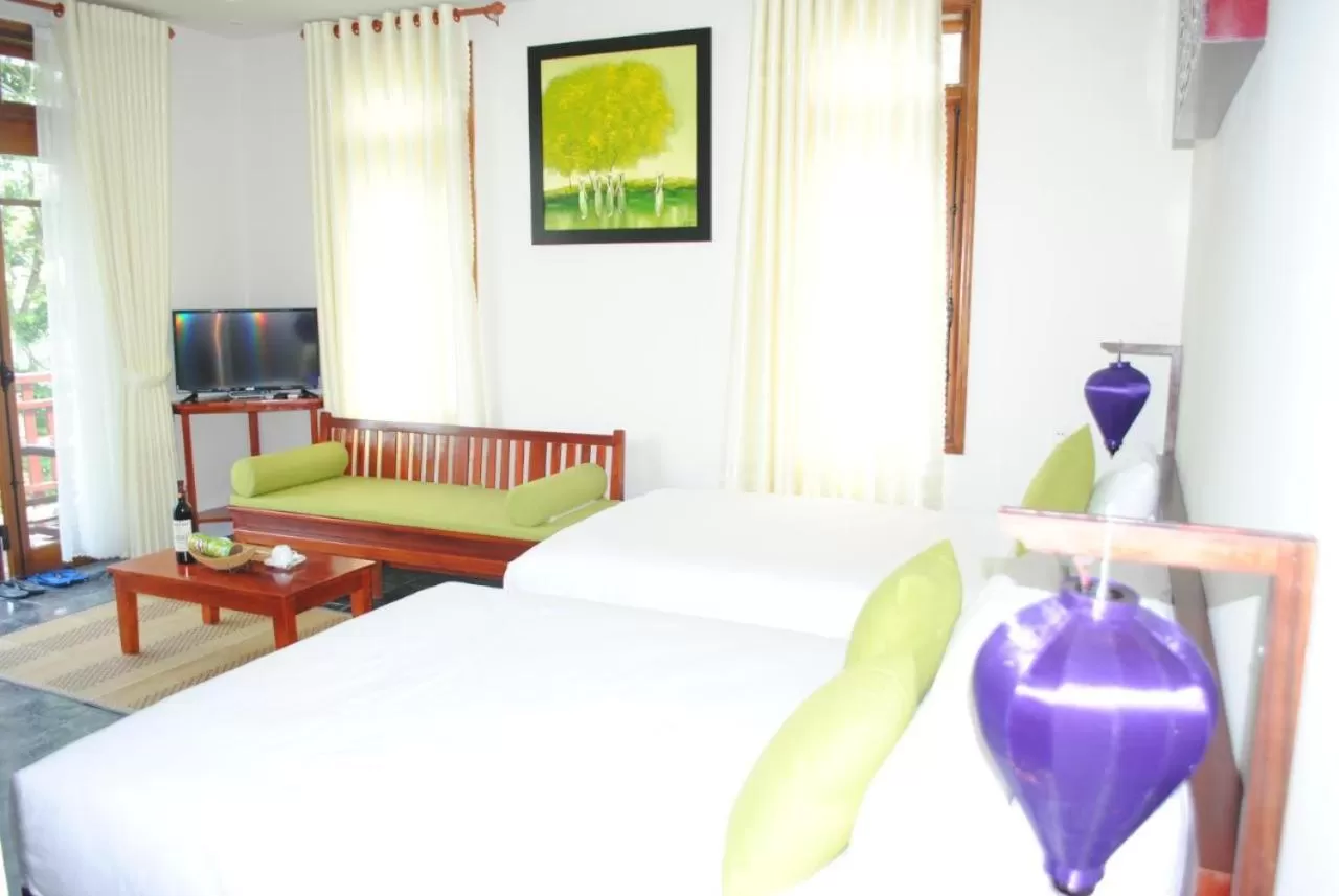 Bed in Hoi an Osaka Riverside Villa & Spa