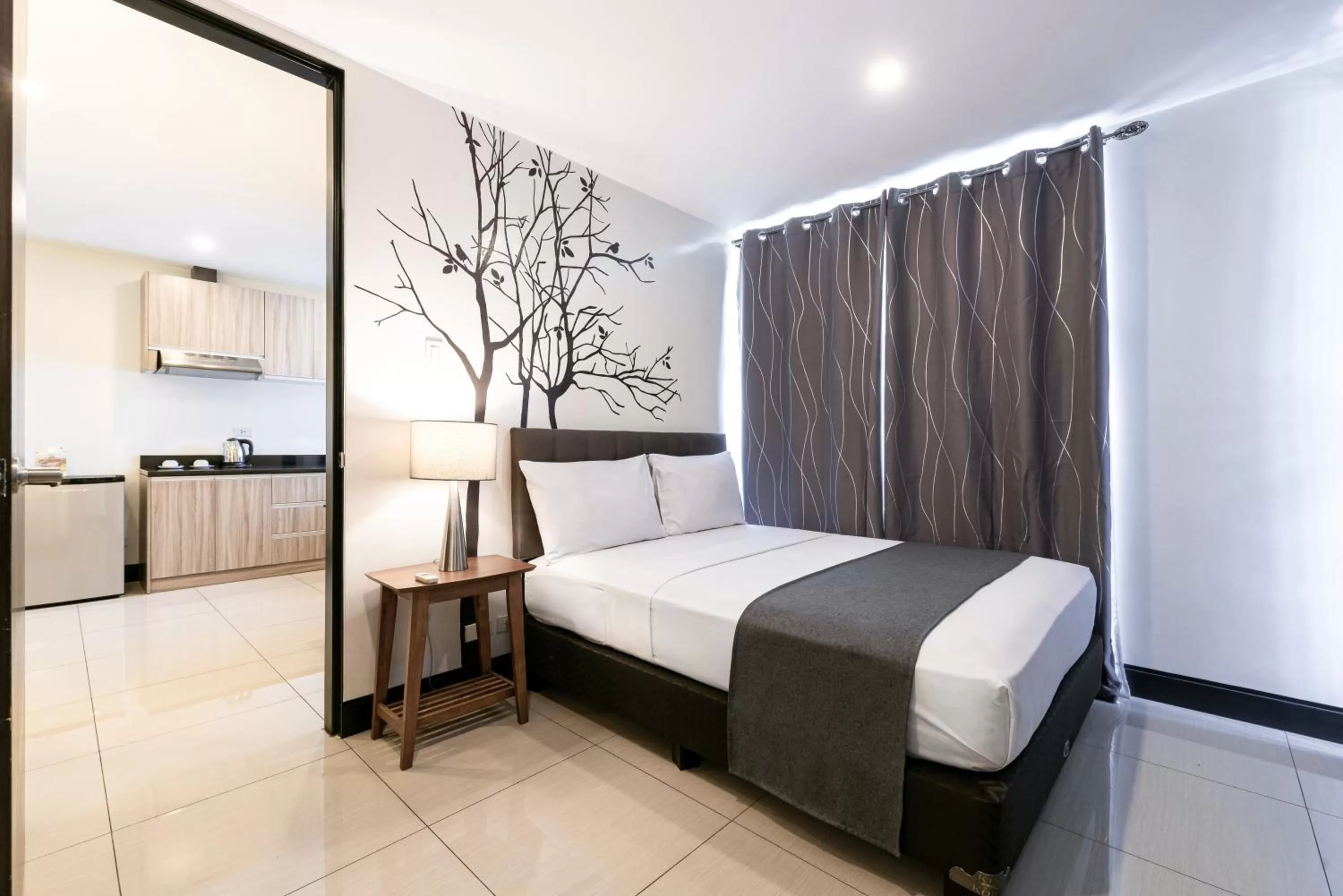 Bedroom, Bed in Artemis Place Makati Hotel