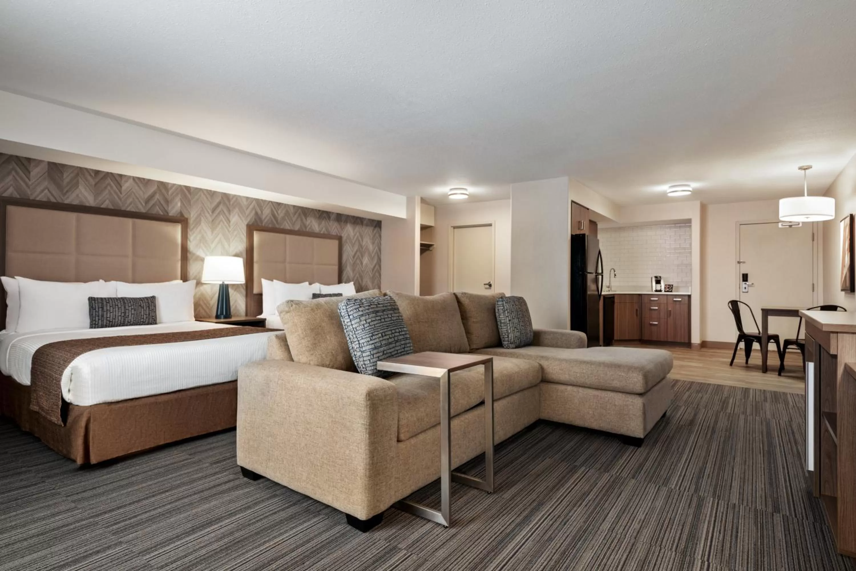 Photo of the whole room, Bed in Ramada by Wyndham Airdrie Hotel & Suites