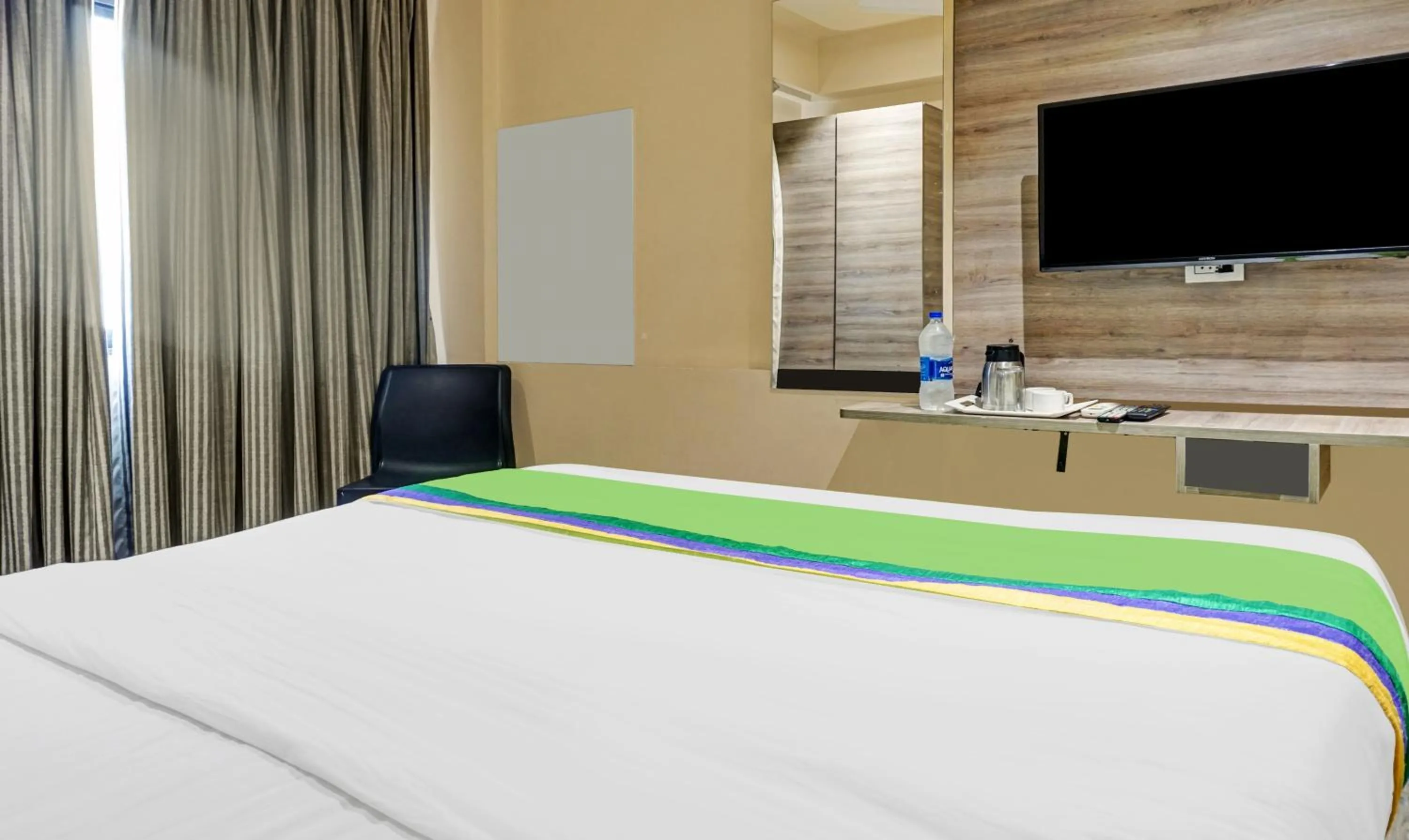 Bedroom, Bed in Treebo Classic Grande, Camp