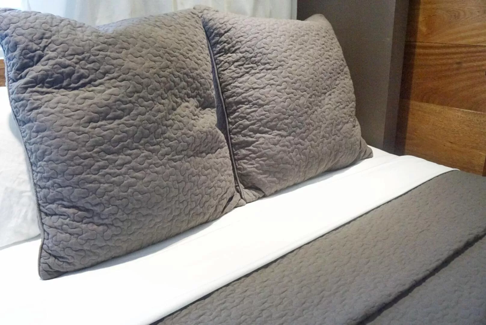 Bed in Marcel Suites