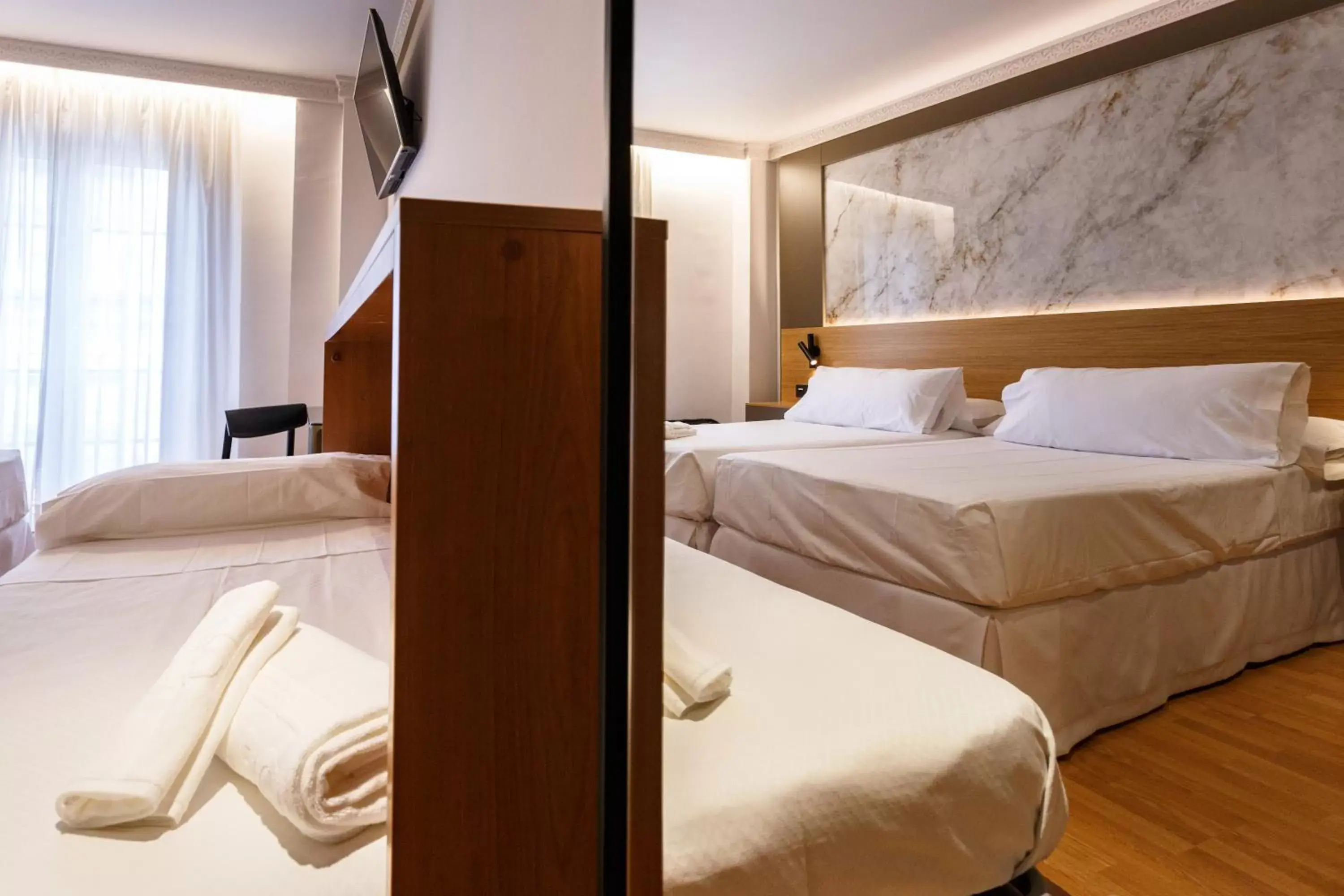 Triple Room in Hotel Dauro Premier Triple Room in Hotel Dauro Premier