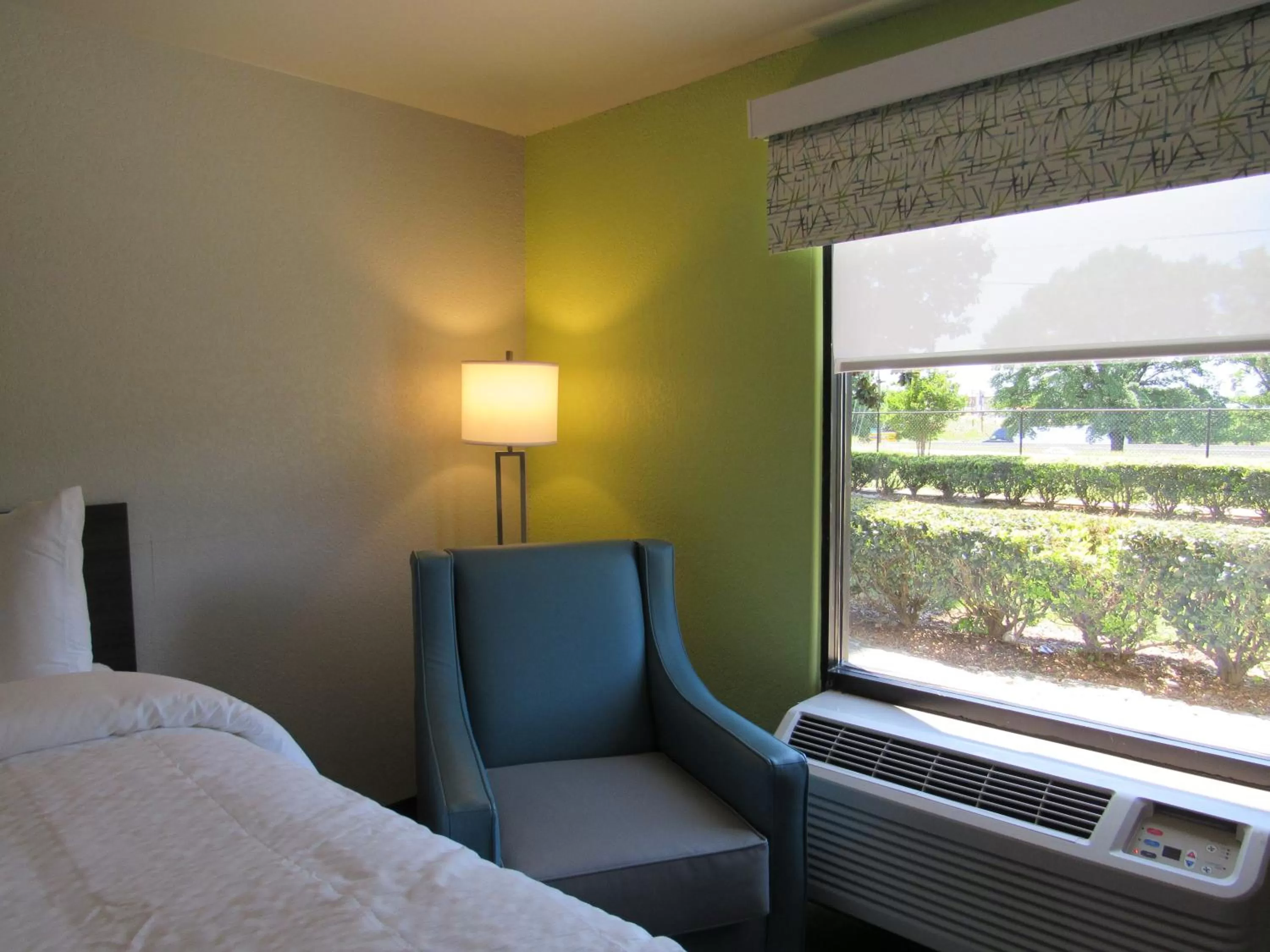 Seating area, Bed in Clarion Pointe McDonough