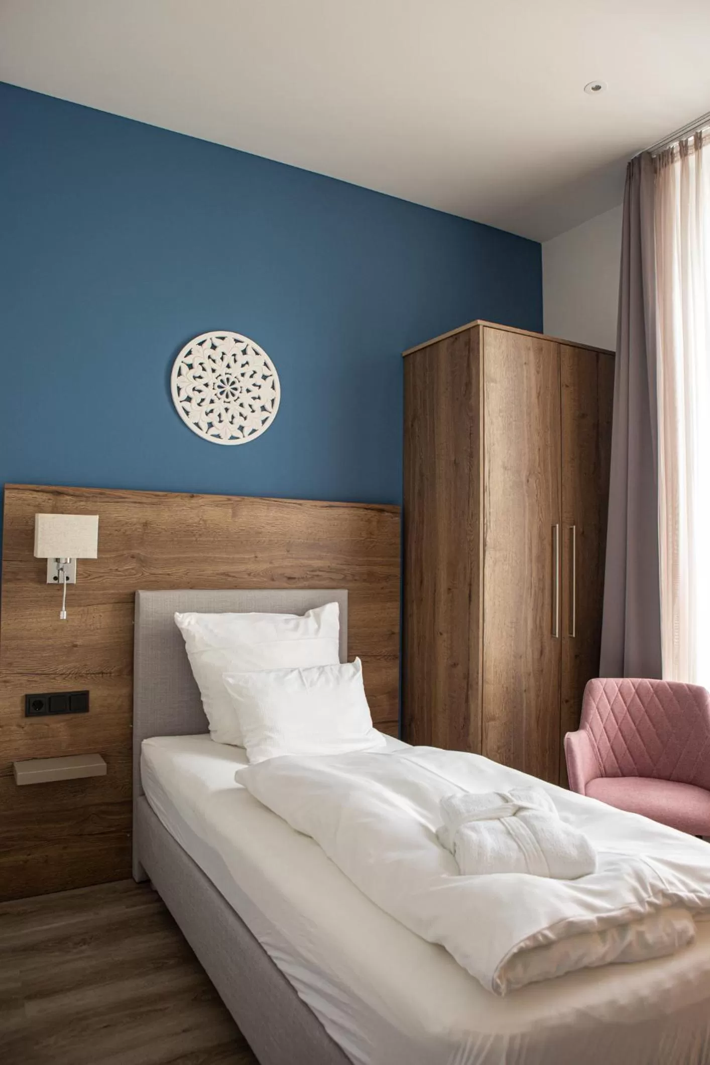 Bed in Romantik Hotel Aquarium