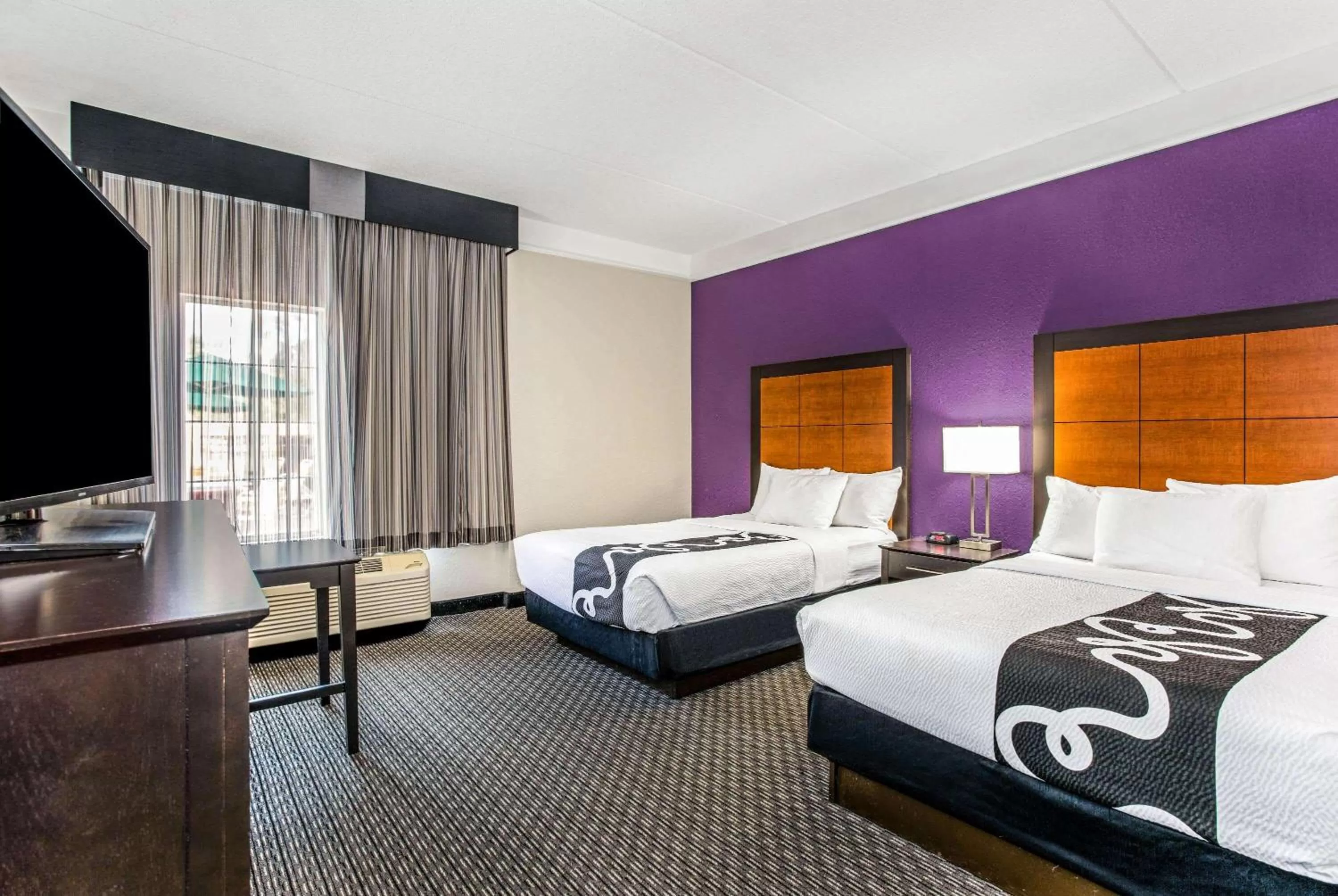 Photo of the whole room, Bed in La Quinta by Wyndham Orlando Airport North - Free Airport Shuttle!