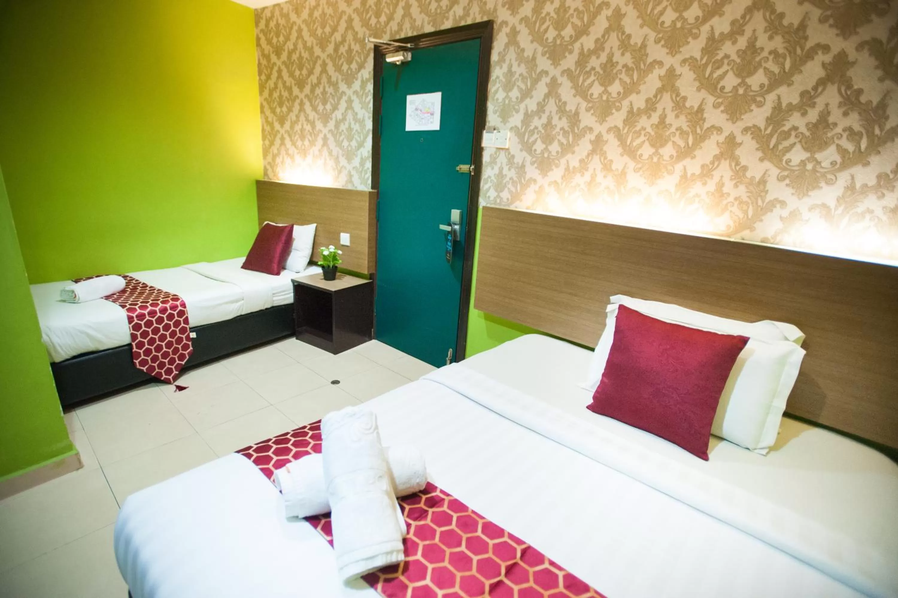 Bed in DJ Citi Point Hotel