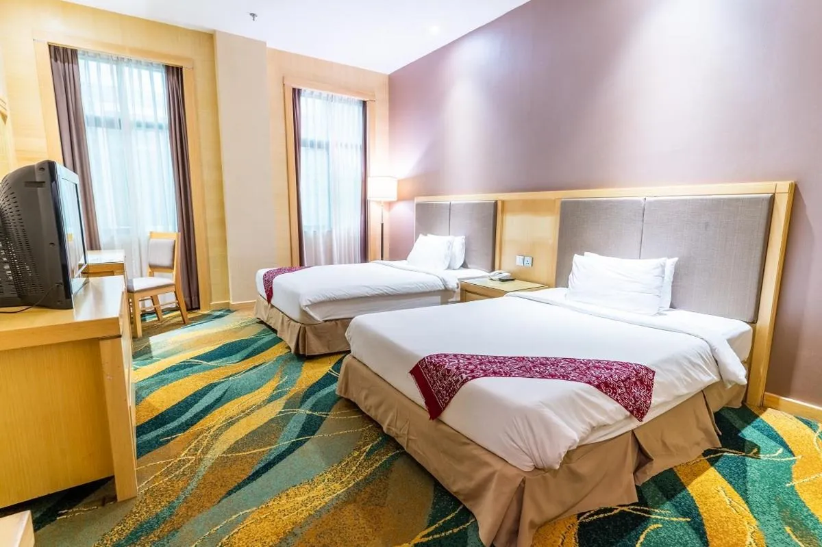 Bed in Imperial Palace Hotel