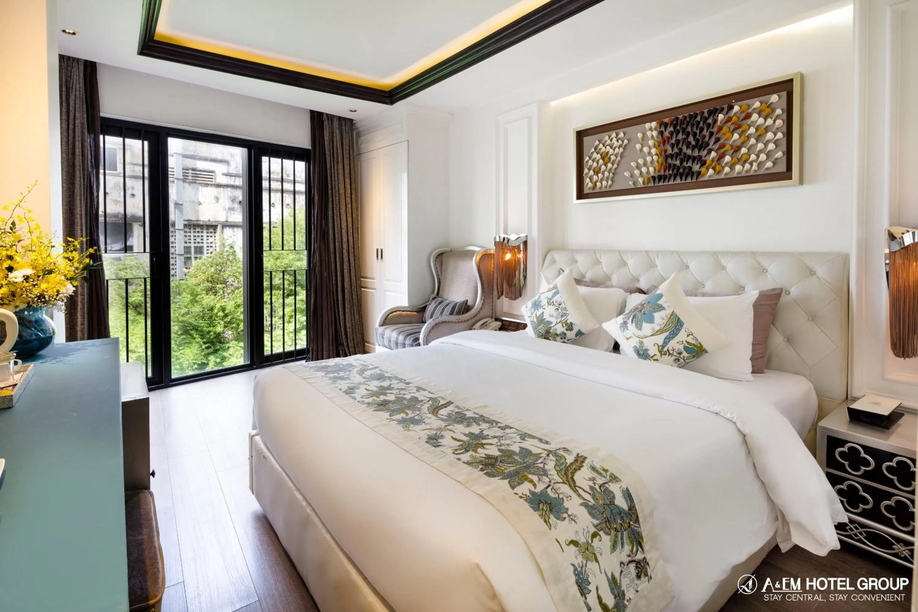 Bed in A&EM Saigon Hotel