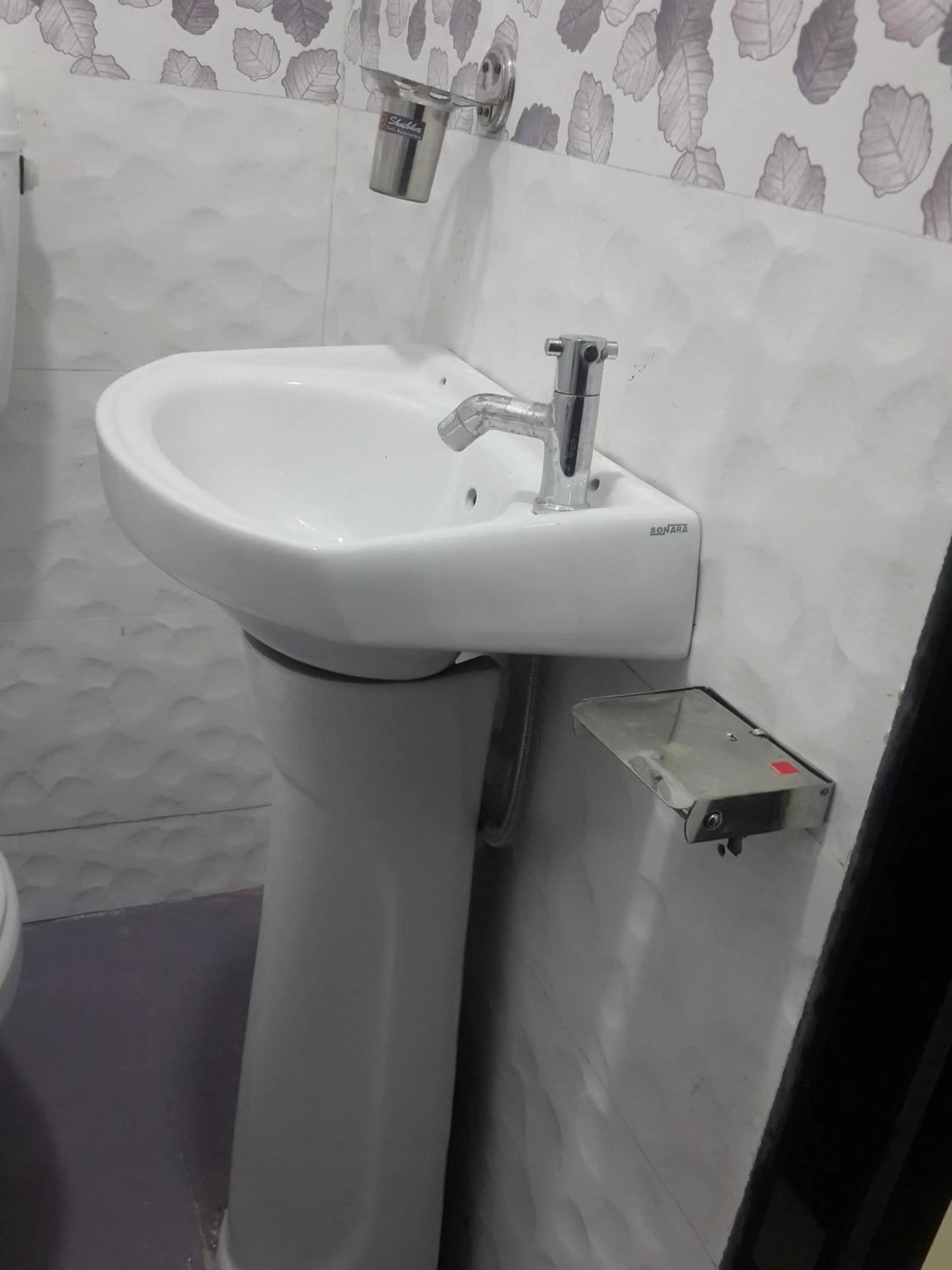 People in Hotel Holiday Era Opposite Railway Station