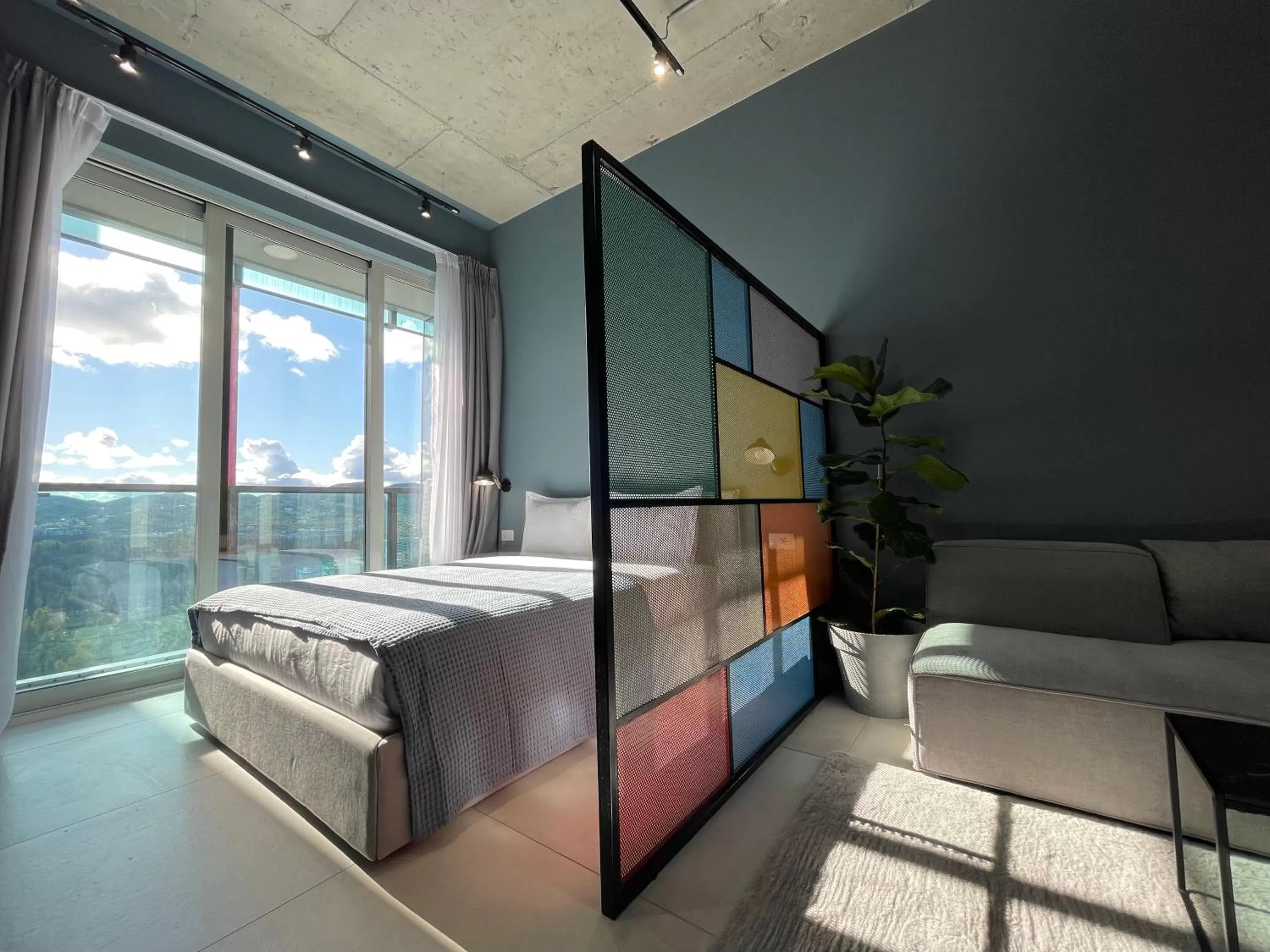 Bed in Ambassador Skyline Apartments