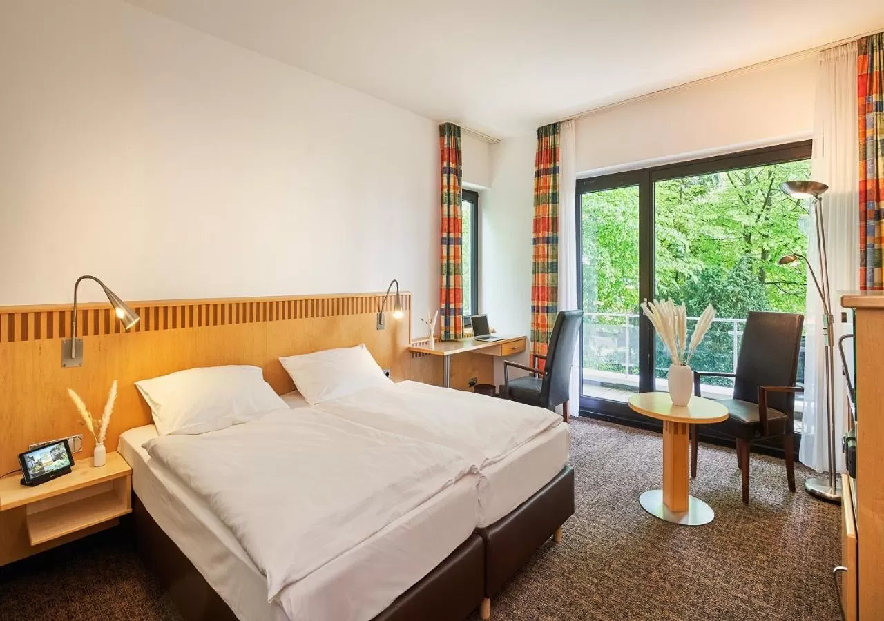 Photo of the whole room, Bed in Parkhotel Nümbrecht