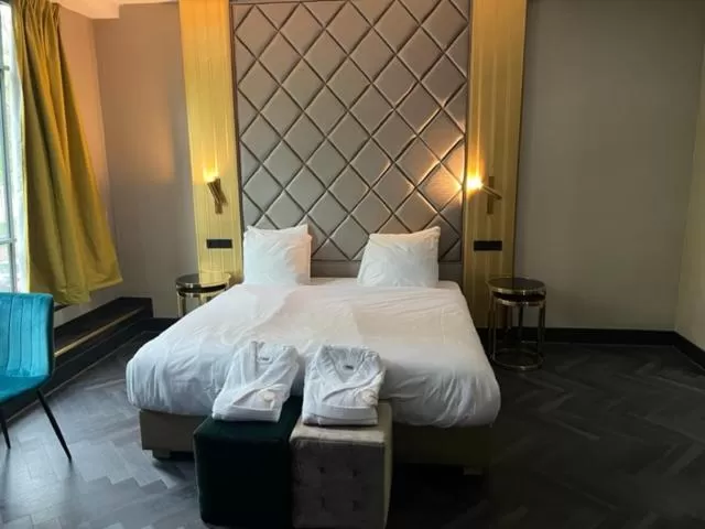 Photo of the whole room, Bed in Triple G Hotels