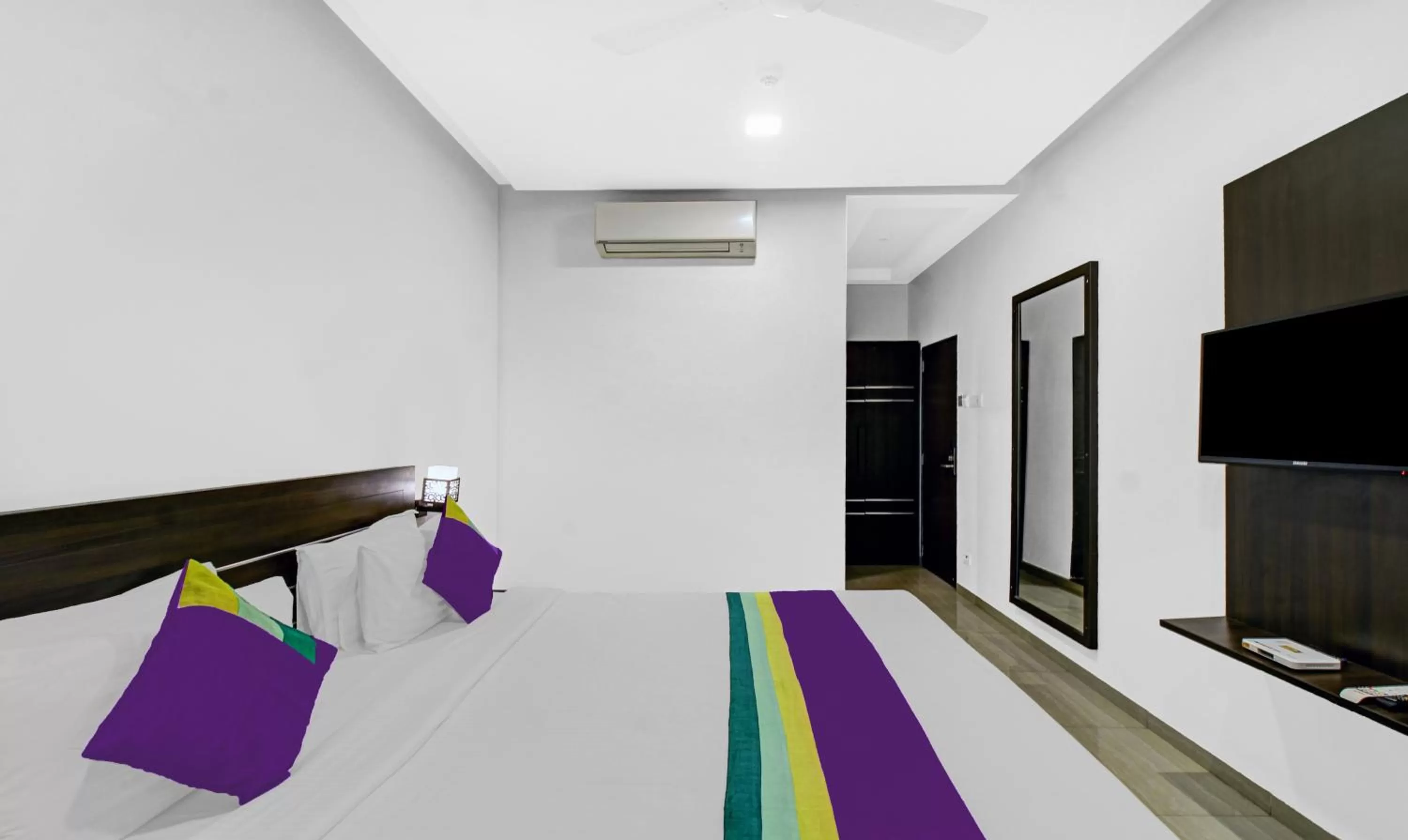 Bedroom, Bed in Treebo Premium Brijinn