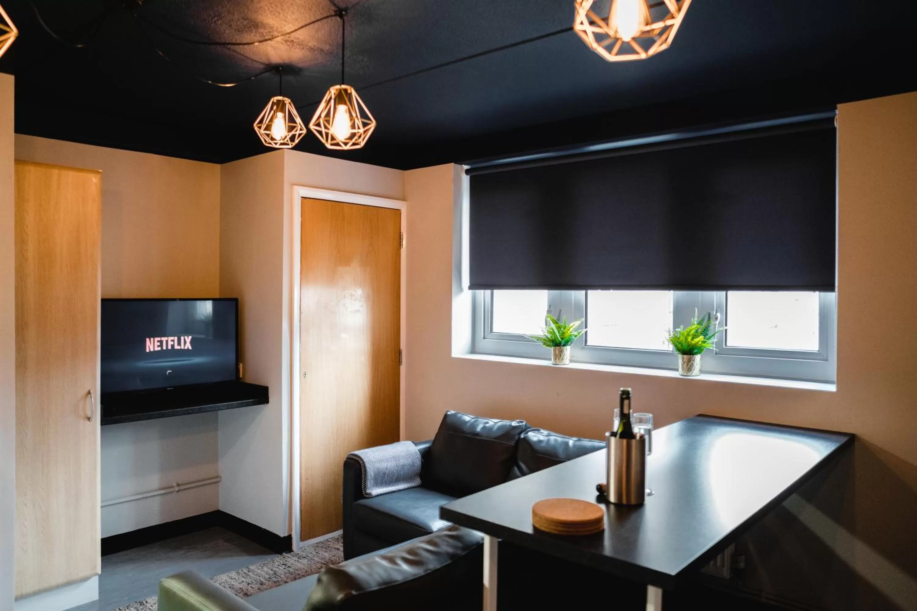 Communal lounge/ TV room in The Venue Serviced Apartments