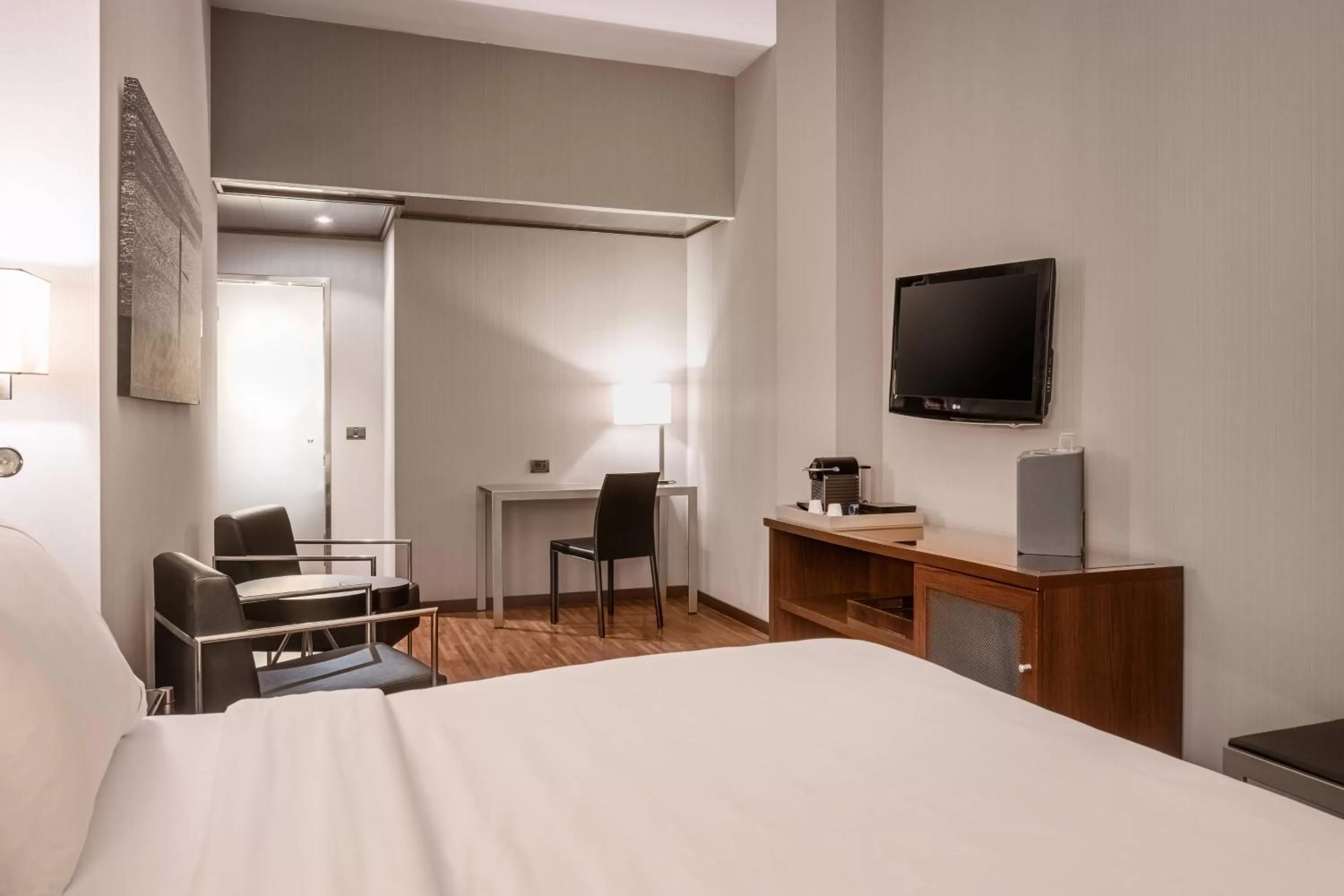 Living room, Bed in AC Hotel Palacio Universal by Marriott