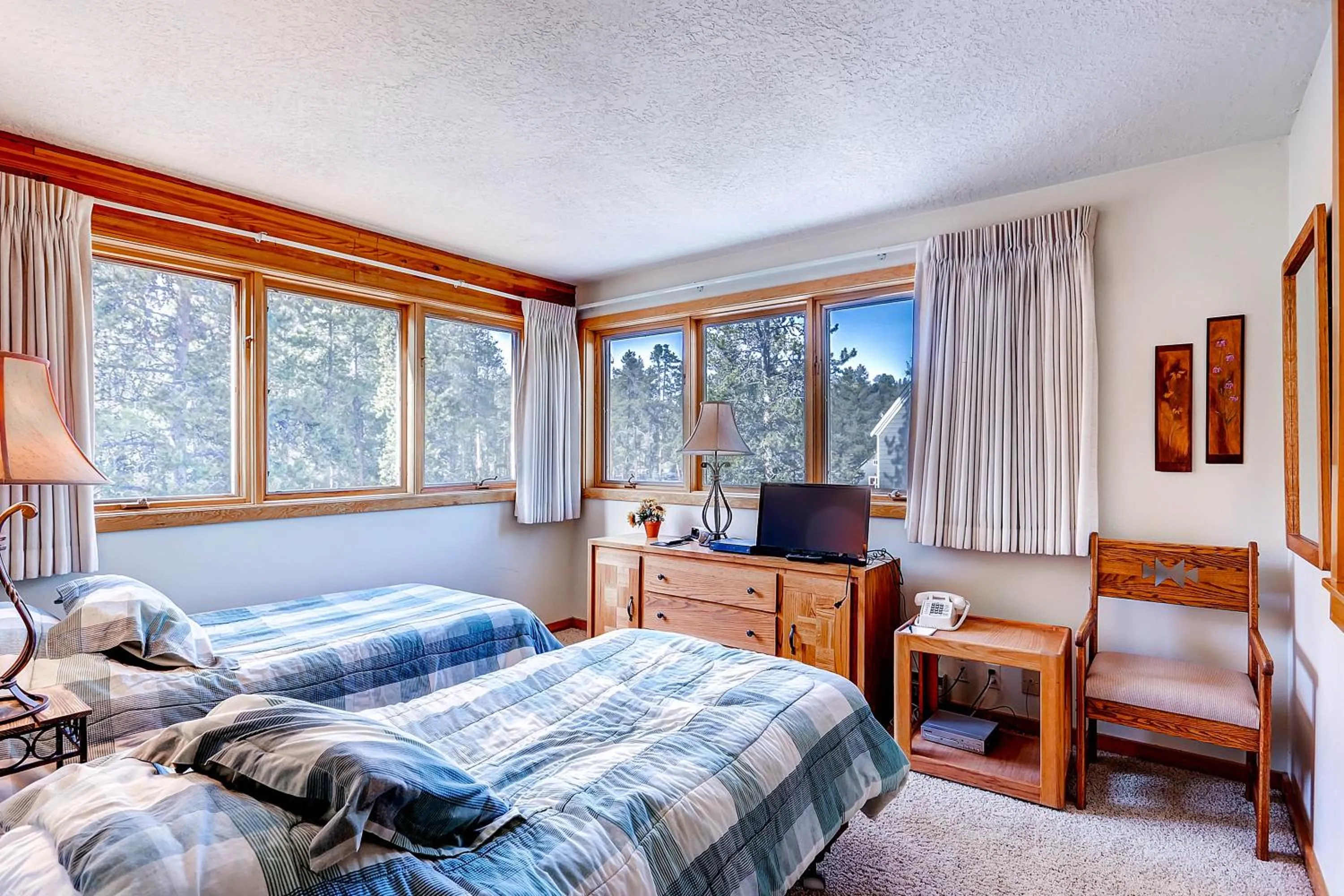 Bed in Evergreen Condominiums by Vail Resorts