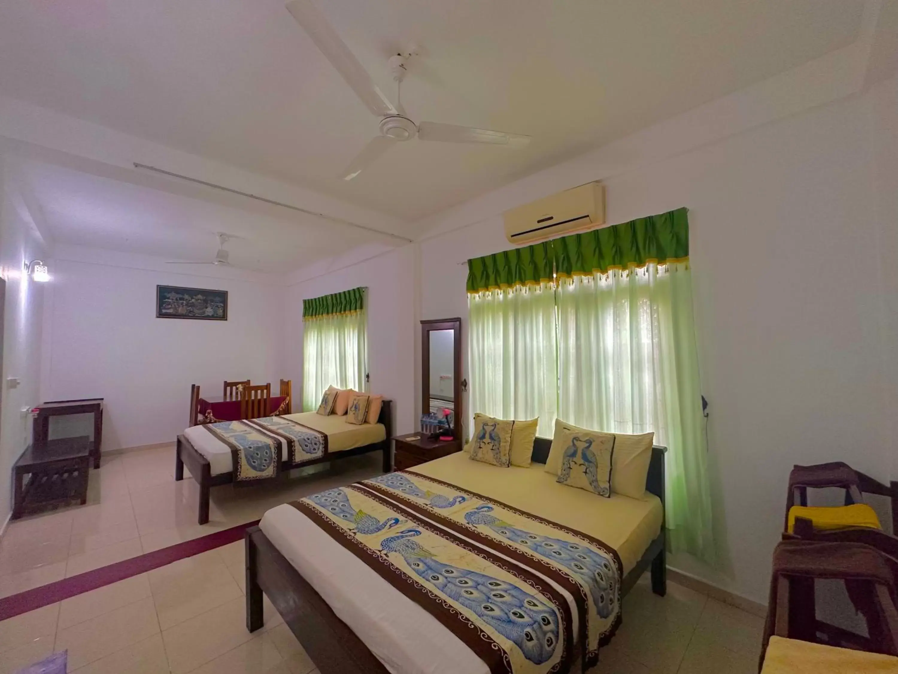 Economy Quadruple Room in New Peacock Resort Economy Quadruple Room in New Peacock Resort